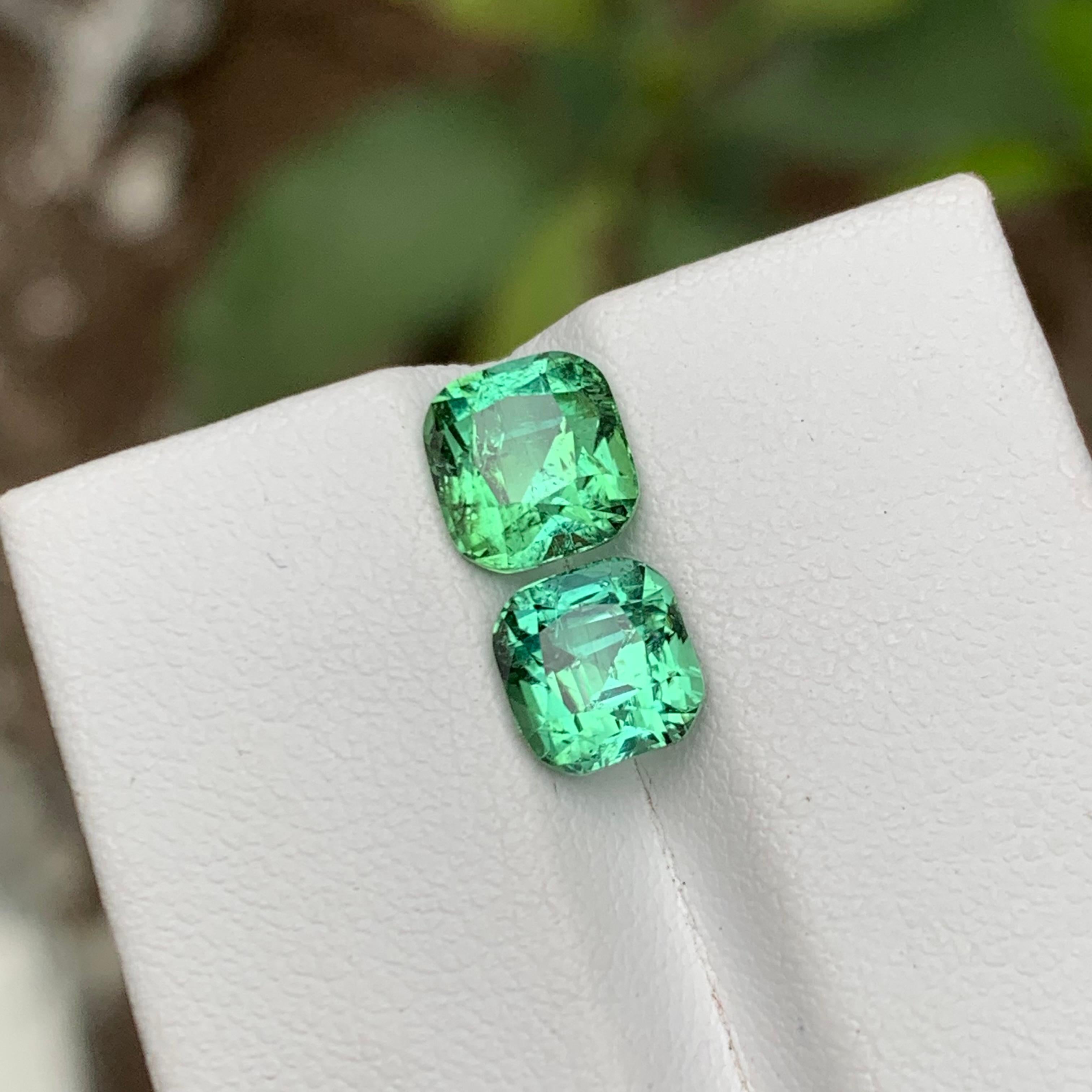 GEMSTONE TYPE: Tourmaline
PIECE(S): 2
WEIGHT: 3.75 Carats
SHAPE: Cushion 
SIZE (MM): 
1.95 Carat: 7.06 x 6.72 x 5.44
1.80 Carat: 6.62 x 6.35 x 5.71
COLOR: Mint Green
CLARITY: Slightly Included 
TREATMENT: None
ORIGIN: Afghanistan
CERTIFICATE: On