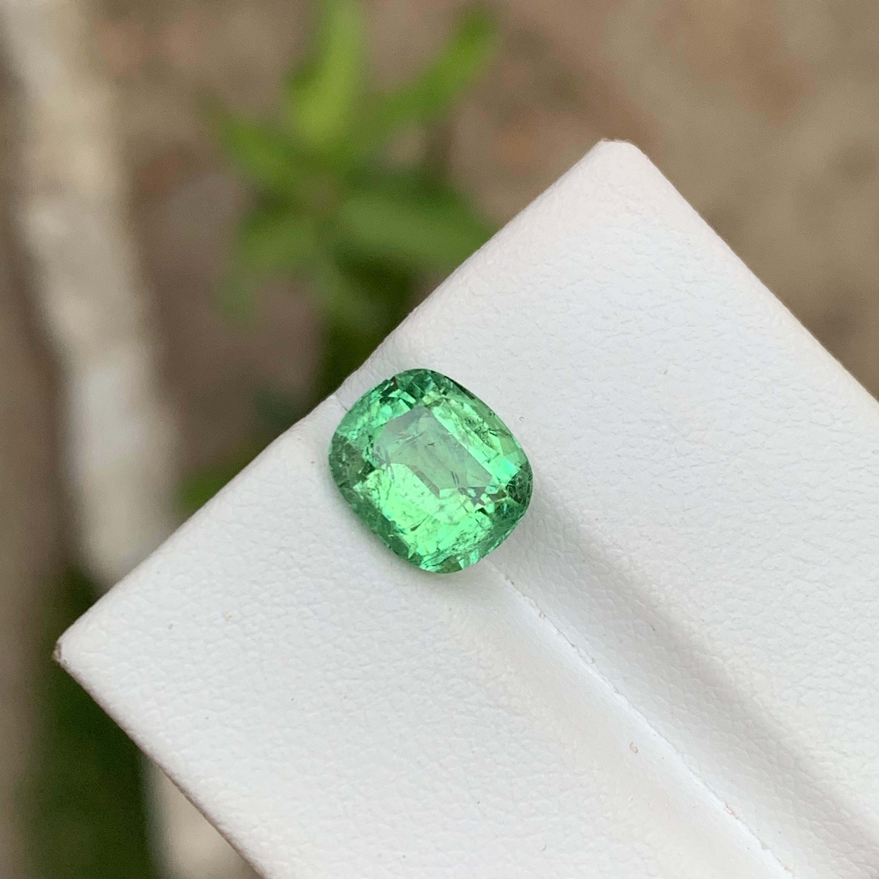 GEMSTONE TYPE: Tourmaline 
PIECE(S): 1
WEIGHT: 2.95 Carats
SHAPE: Cushion
SIZE (MM): 9.22 x 7.83 x 5.58
COLOR: Mint Green
CLARITY: Moderately Included
TREATMENT: None
ORIGIN: Kunar, Afghanistan 
CERTIFICATE: On demand
(if you require a certificate,