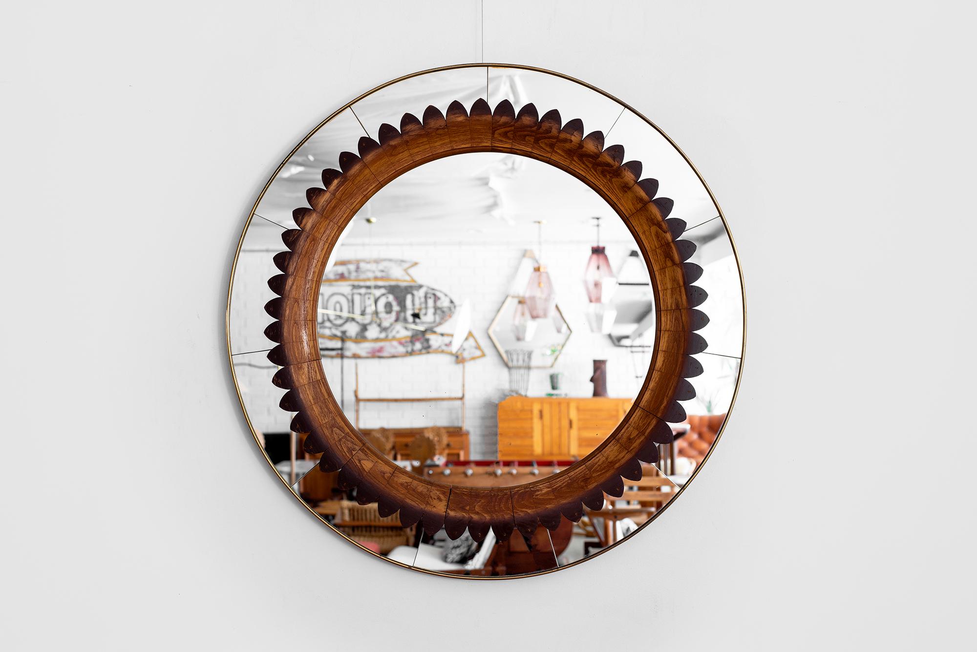 Rare Italian mirror designed by Fratelli Marelli for Framar, circa 1940s.
Walnut scalloped detailing with brass trim.
Wonderful patina and condition of mirror.
A sculptural piece of art.