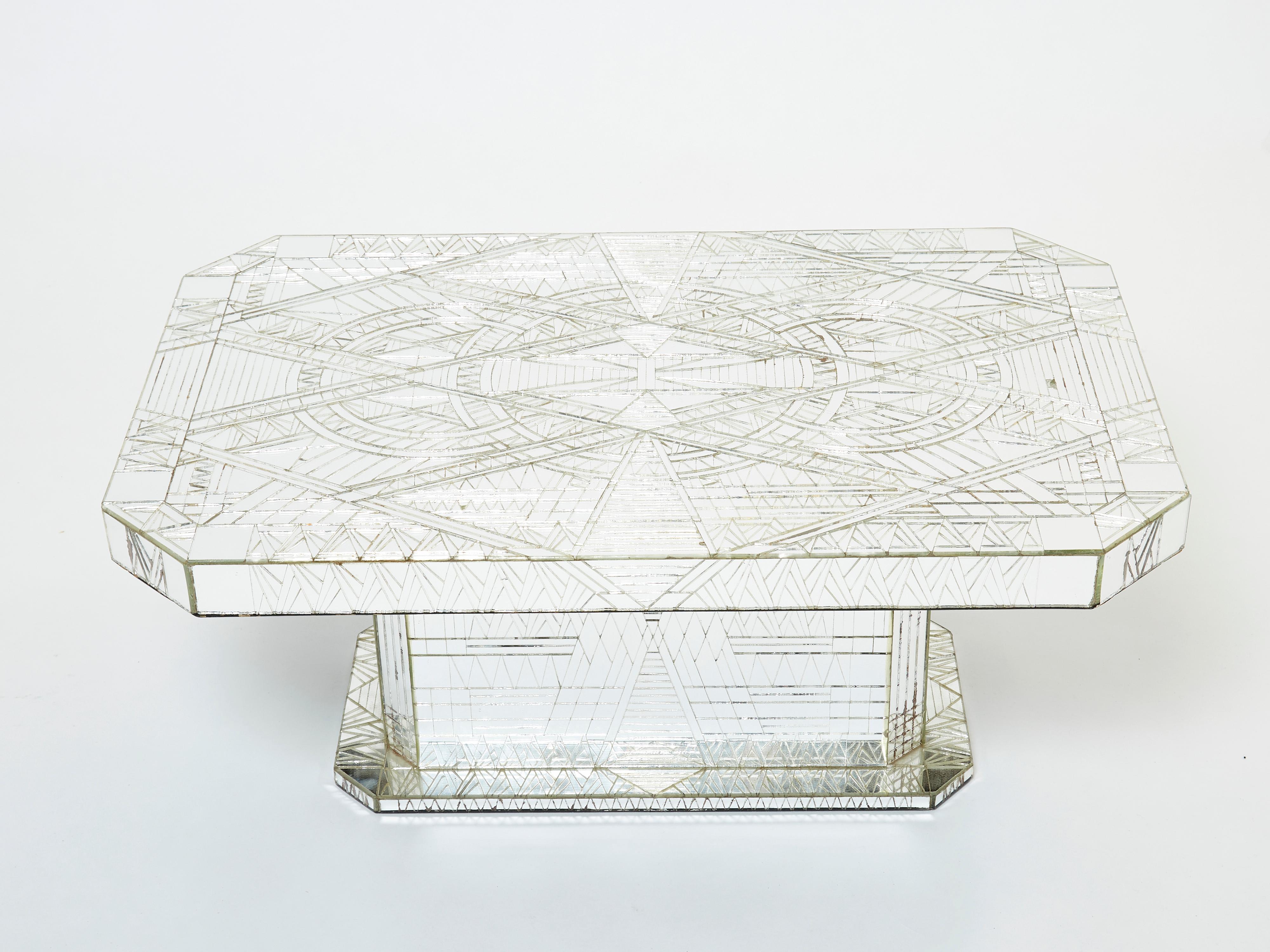 The artful design of this small coffee table made by Daniel Clément in the 1970s was brought to life with hundreds of carved mirror pieces, arranged to form a tight mosaic. The mosaic is so precise that the design almost seems to have been created
