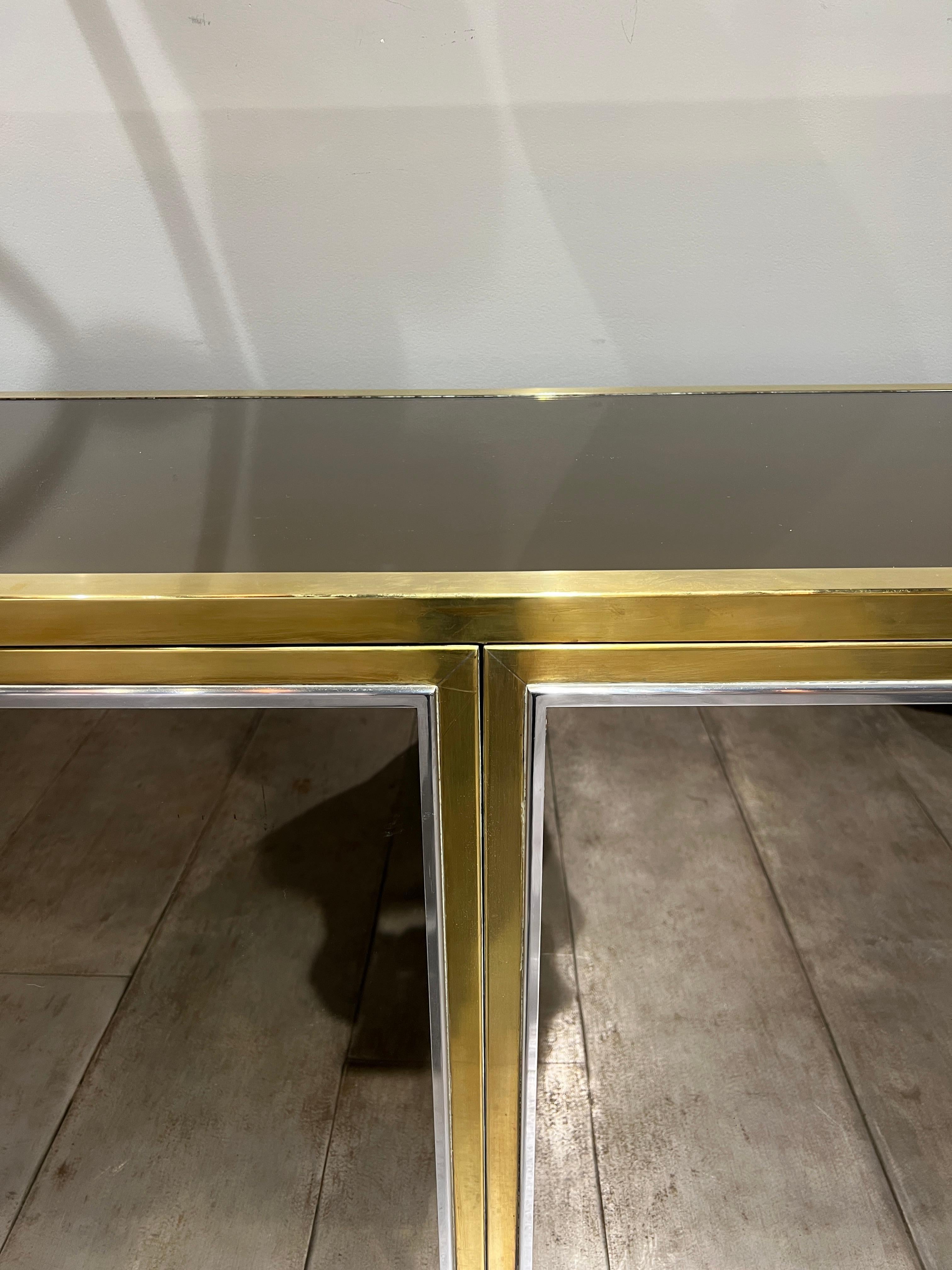 A rare mirrored credenza with brass and steel, lucite base by Sandro Petti for Michel Pigneres 
3 doors en 4 drawers.