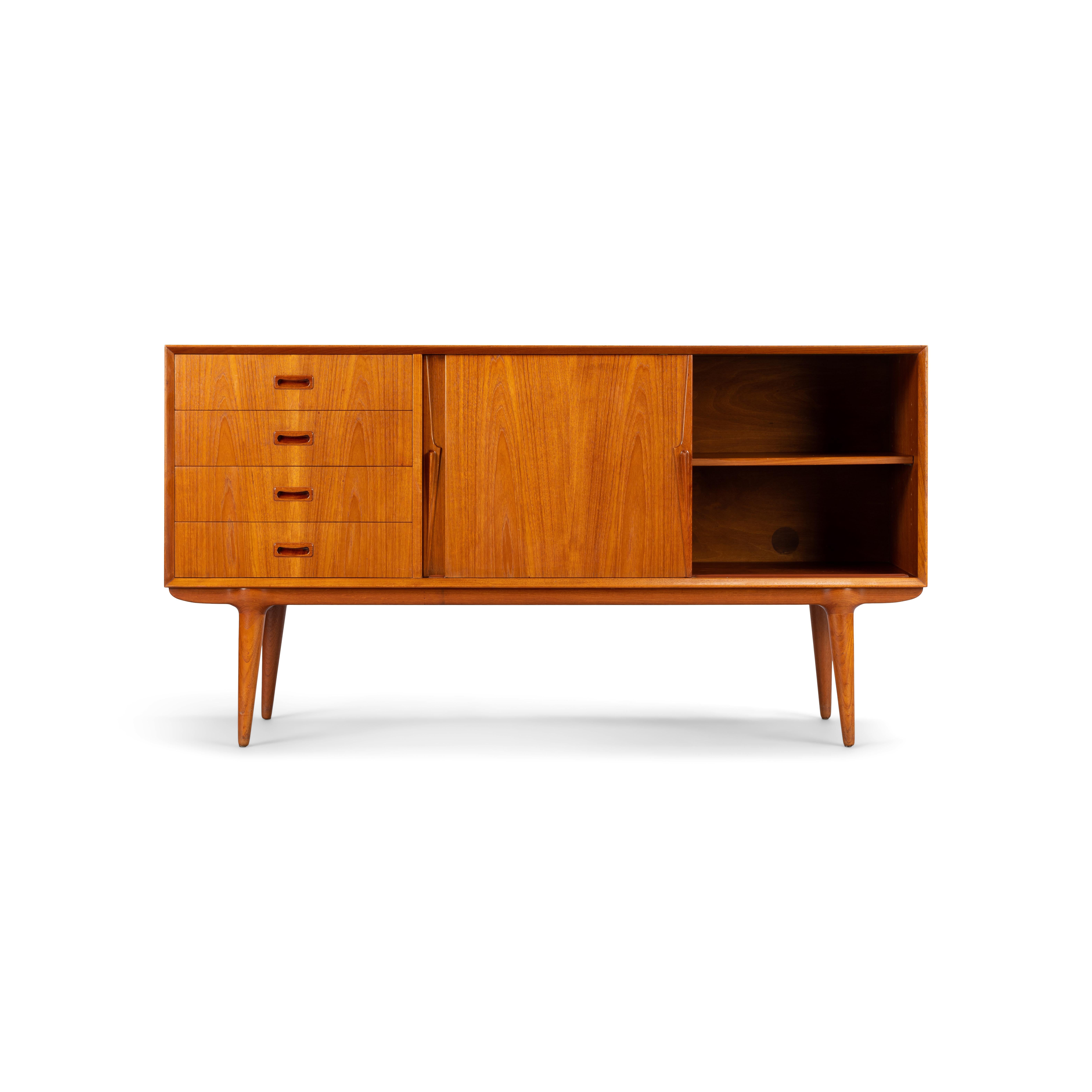 A Classic among credenza's, this teak model #12 credenza designed by Gunni Omann for Omann Jun Møbelfabrik. Recognisable design features and perfectly proportioned, with a raised height of 85cm, this piece will work well with any modern decor.