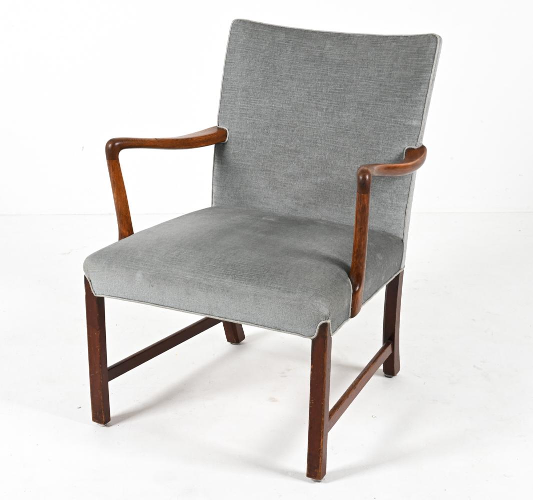 Presenting an important and rare signed Model 1756 armchair, designed by Ole Wanscher for the legendary Danish furniture maker Fritz Henningsen. This exceptional chair is a snapshot in time; a primary source that gives direct insight into the work