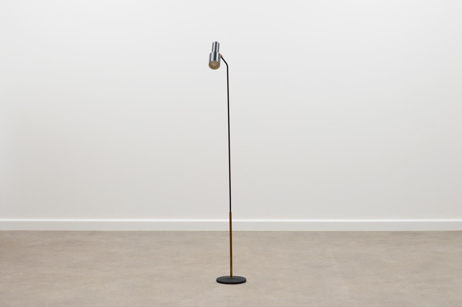 Rare Model “1968” floor lamp by Fontana Arte, Italy 60s. Minimalistic black lacquered brass lamp with cast iron shrink lacquered base. The shade can be adjusted due to the ball joint. Nice patina and in very good vintage condition.

Catalogue