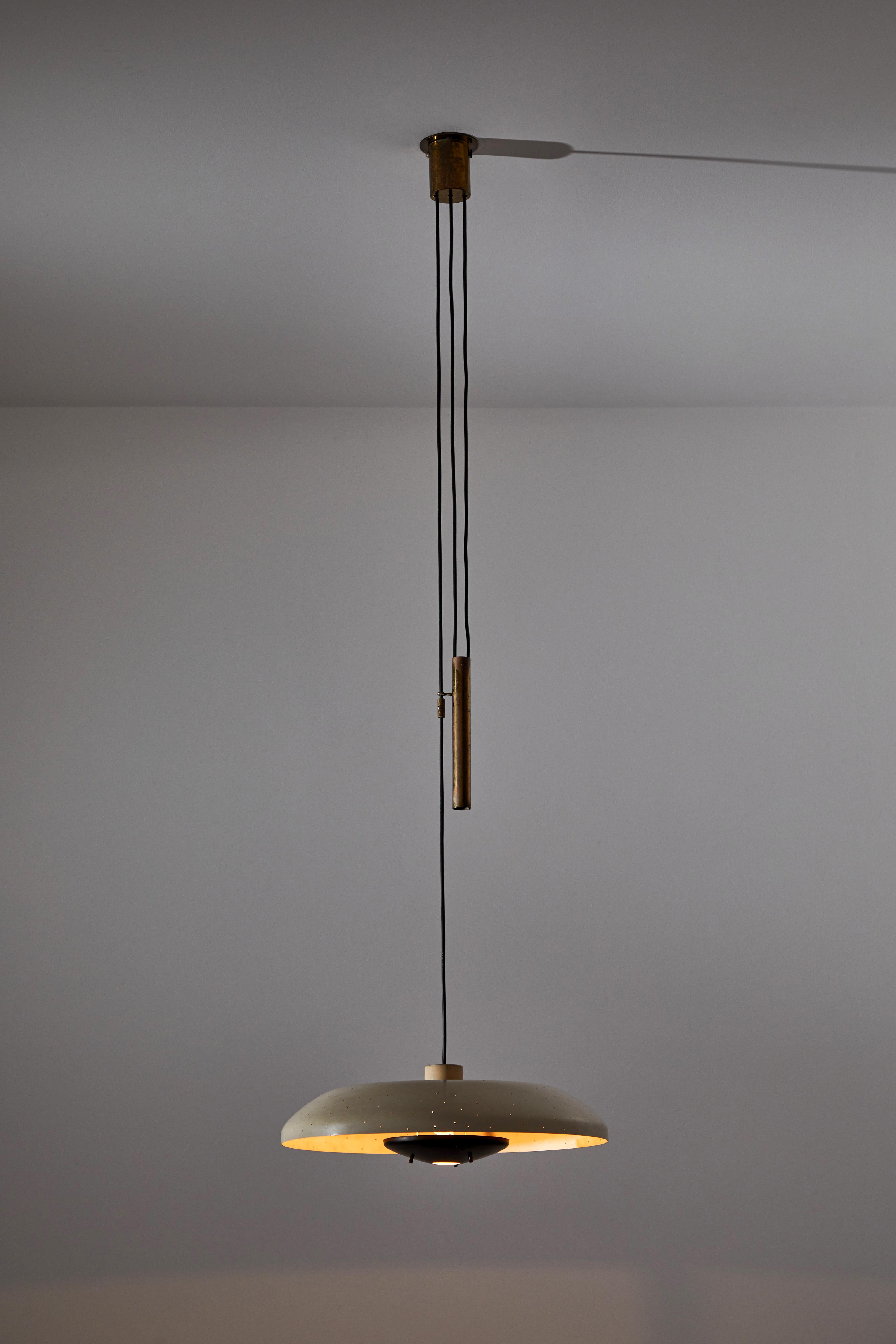 Rare model 2069 counterweight suspension light by Gino Sarfatti for Arteluce. Designed and manufactured in Italy, 1952. Painted aluminum, solid brass counterweight, original canopy, custom brass ceiling plate. Rewired for U.S. standards. We