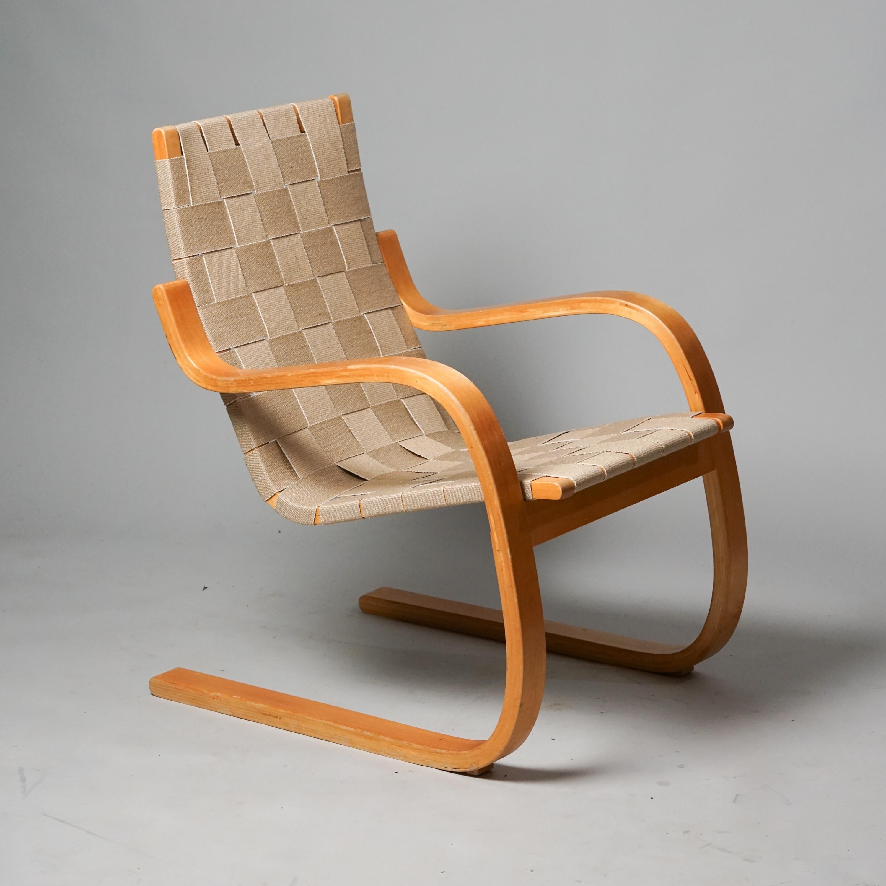 Rare model 30 armchair, designed by Alvar Aalto, manufactured by Oy Huonekalu- ja Rakennustyötehdas Ab, 1950s. Birch frame, cotton weaved seat. Good vintage condition, minor patina consistent with age and use. 

Alvar Aalto (1898-1976) is probably