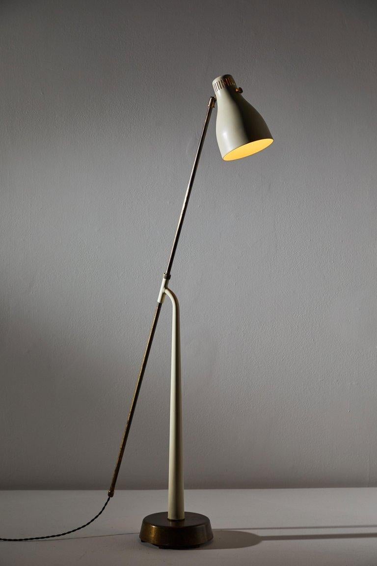 Model 541 floor lamp by Hans Bergstrom for Atelje Lyktan. Designed and manufactured in Sweden, 1945. Rare metal enameled shade version. Brass hardware. Arm and shade are adjustable. Rewired with black French twist cord. Takes one E27 75W maximum