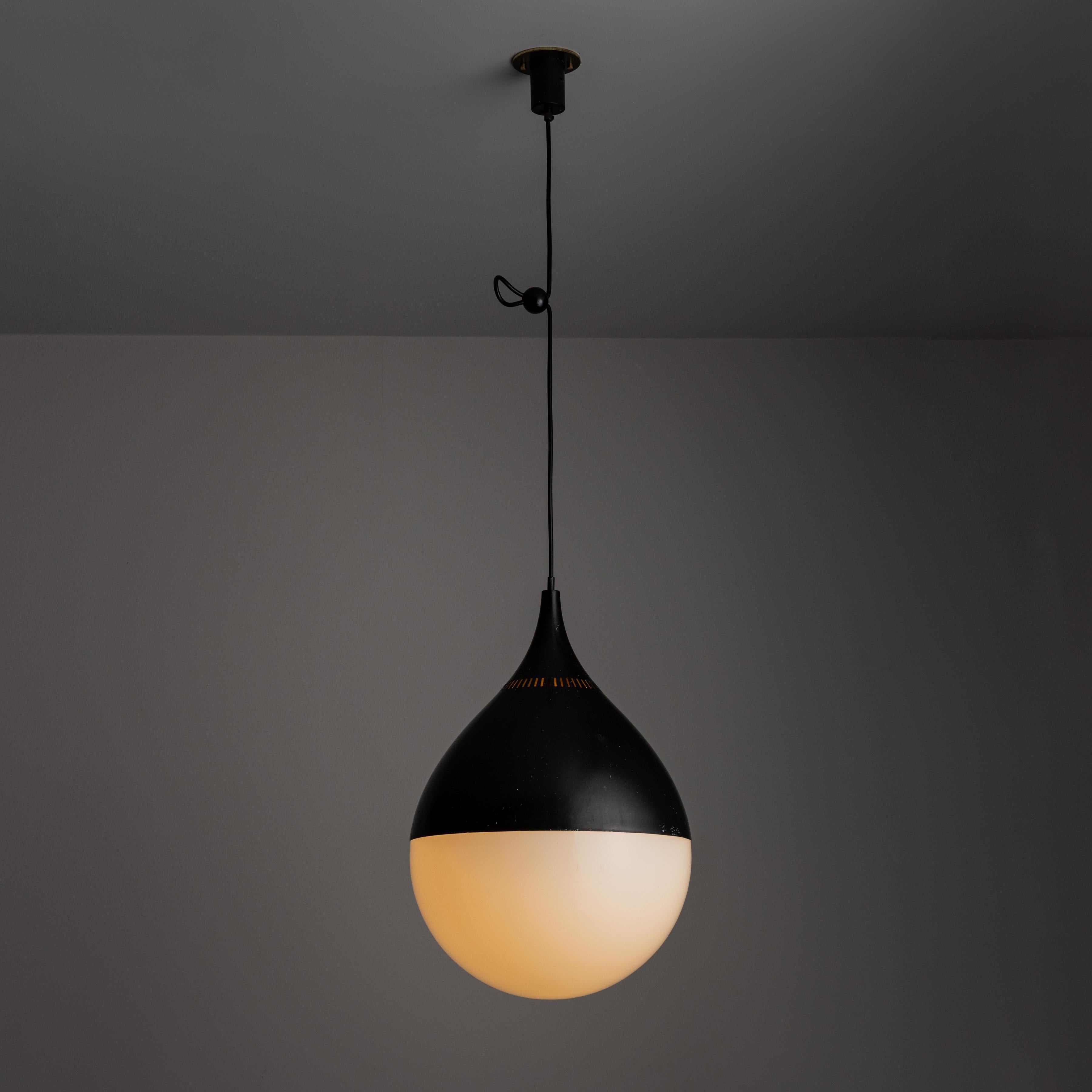 Rare model 622 Ceiling Light for Stilnovo. Designed and manufactured in Italy in 1995. Minimal tear drop ceiling light with soft milk glass diffuser. Black enameled top half with perforations, allowing for an added element. This fixture holds one