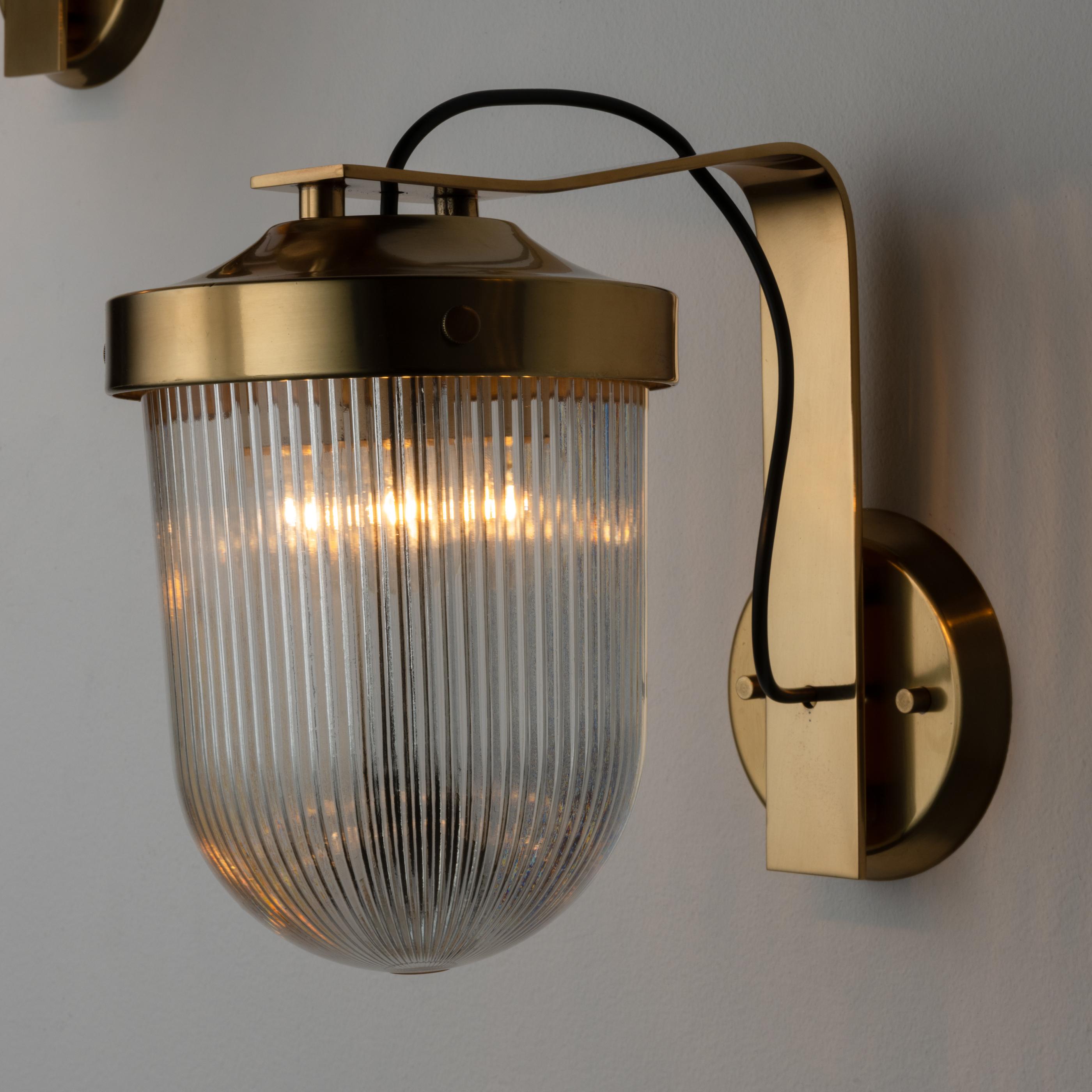 Rare Model G.A. sconce by Fulvio Raboni for Delitala. Designed and Manufactured in Italy, 1959. Curved brass armatures, paired with clear printed glass diffuser. We recommend one E27 40w maximum bulb. Wired for US. Bulb included as a one time