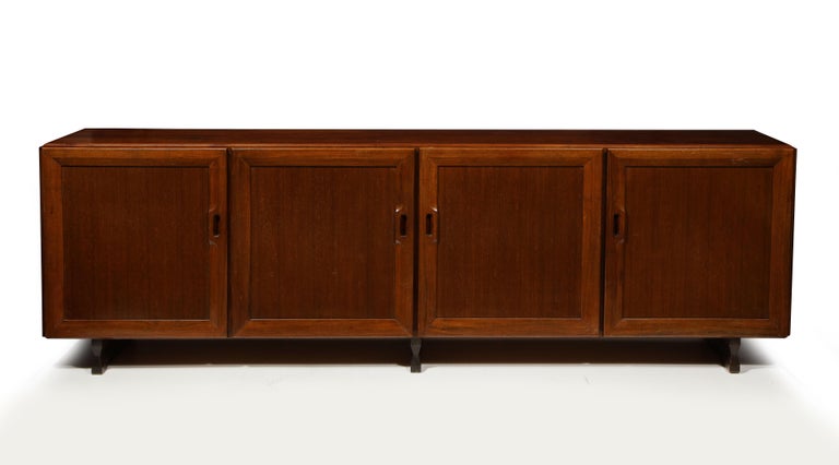 Model MB15 Walnut sideboard by Franco Albini, Italy, c. 1957. 

This rare and important sideboard was designed by Franco Albini and manufactured by Poggi in 1957. Executed in a rich walnut, the sideboard consists of four storage compartments,