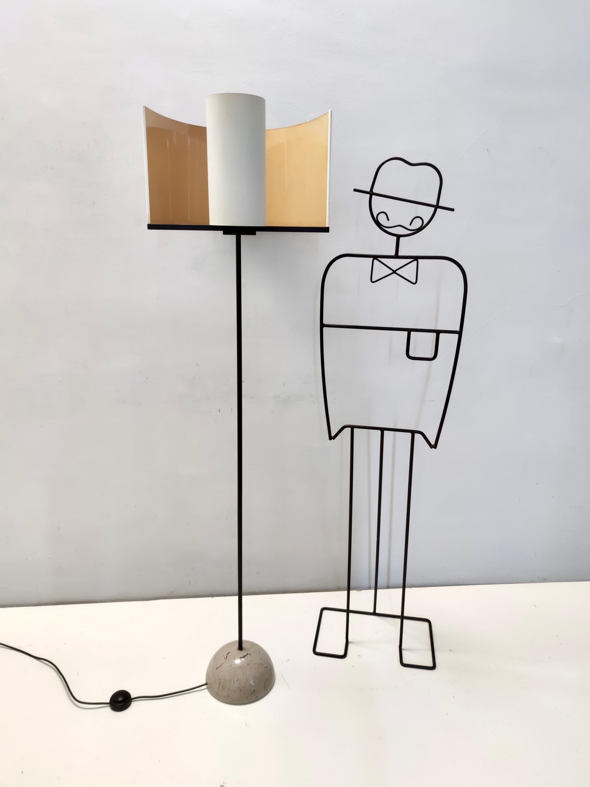 Made in Italy, 1970s - 1980s. 
This beautiful floor lamp features a black varnished metal and steel frame, a shiny grey marble base and a plastic coated fabric lampshade, which have a matte finish outside and a shiny finish inside. 
There are few