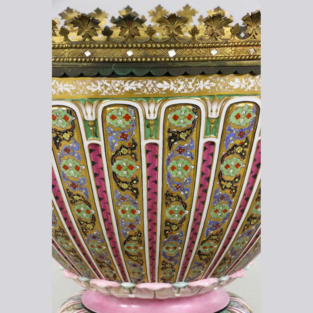 A rare monumental 19th century French Porcelain Urn centerpiece
Highly collectable hand decorated, with bronze leaf border design on top

Date: 19th century
Origin: French
Dimension: 29 in x 26 in.