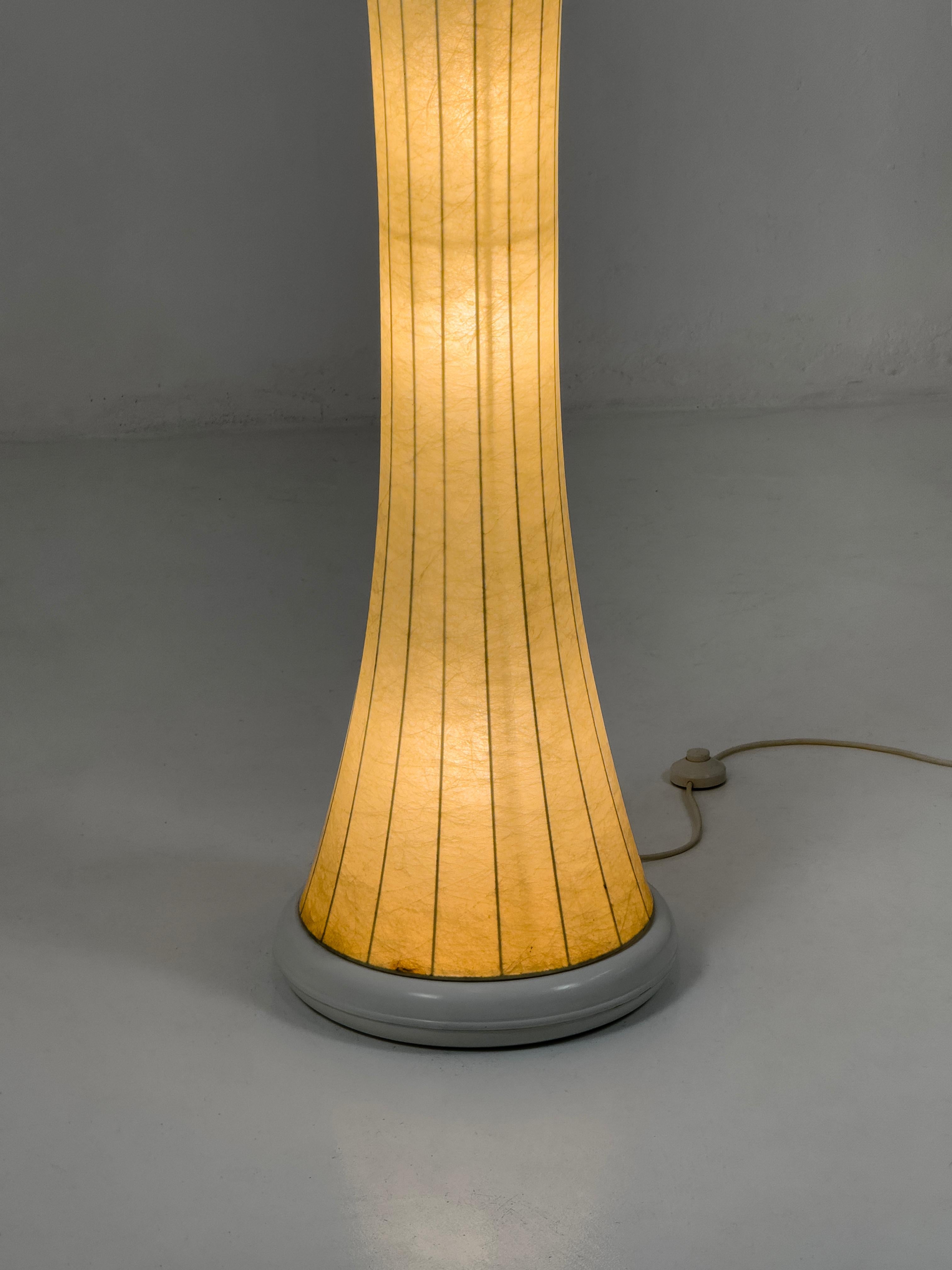 Rare Monumental Italian Cocoon Floor Lamp, Italy 60s

This exceptional piece is a striking example of mid-century modern lighting design. With its unique and sculptural form, the Cocoon floor lamp serves as a true statement piece, making it an ideal