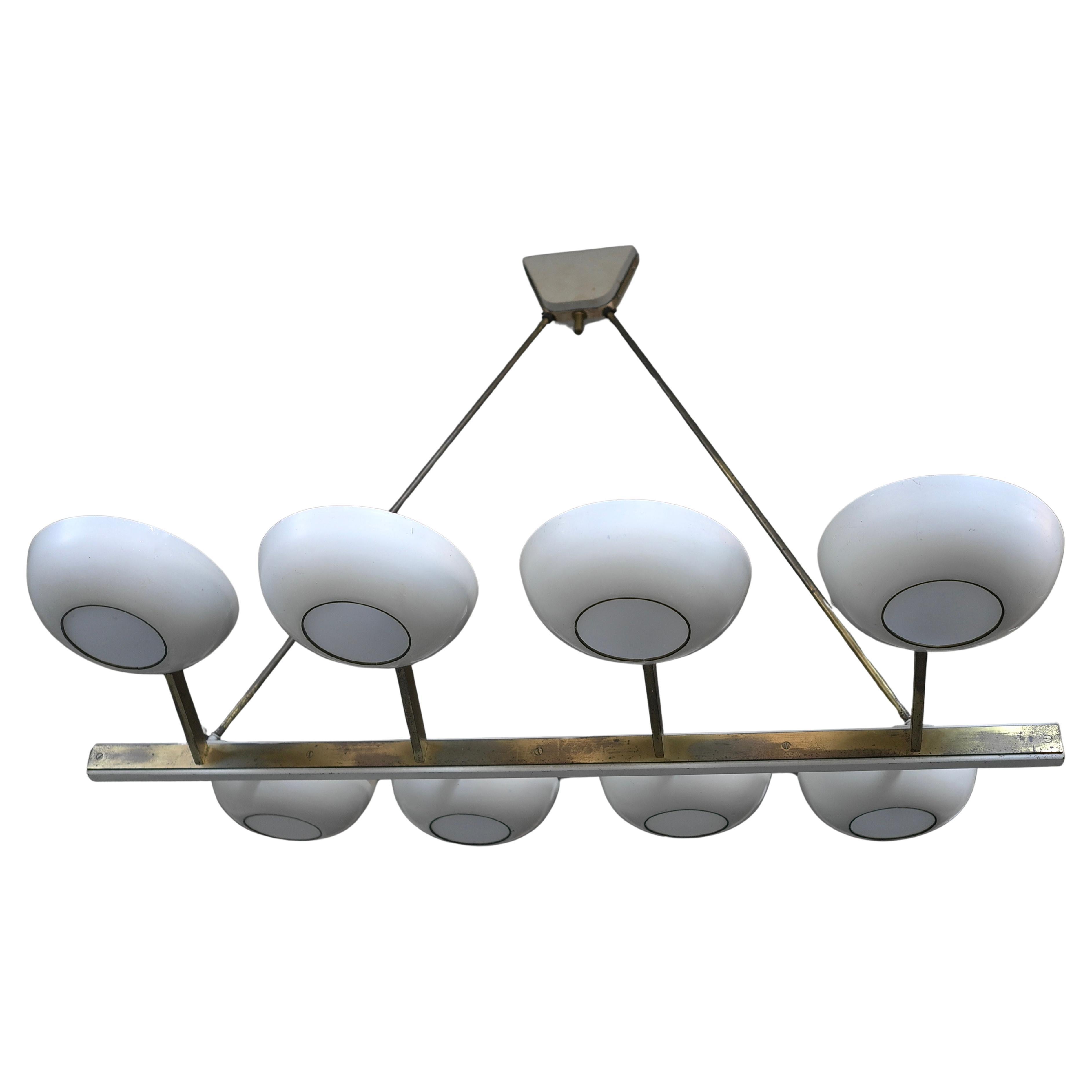 Chandelier made by Stilnovo, Italy, 1950s. Made from white painted metal shades, brass and opaline glass.

Literature: G.Krohne, Formschone lampen, Munchen1952, S.92 (Vanante mit gelochten aluschalen).