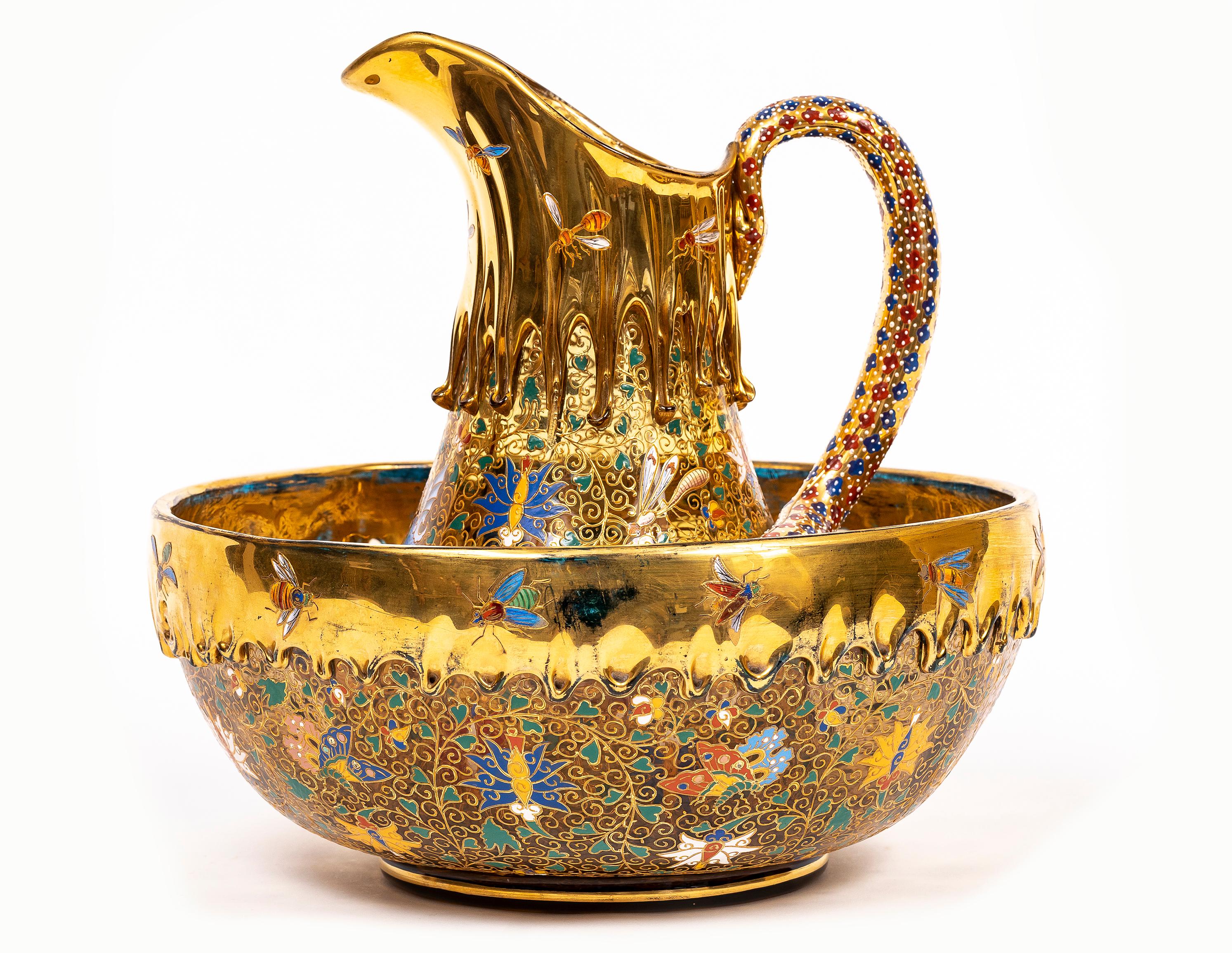A Magnificent Moser Amber Crystal Colored Pitcher and Basin with Enameled Dragon and Salamander Handle, from the Klabin Collection.  A marvelous dragon and an incredible amount of gilding differentiate this incredibly rare Moser pitcher and its