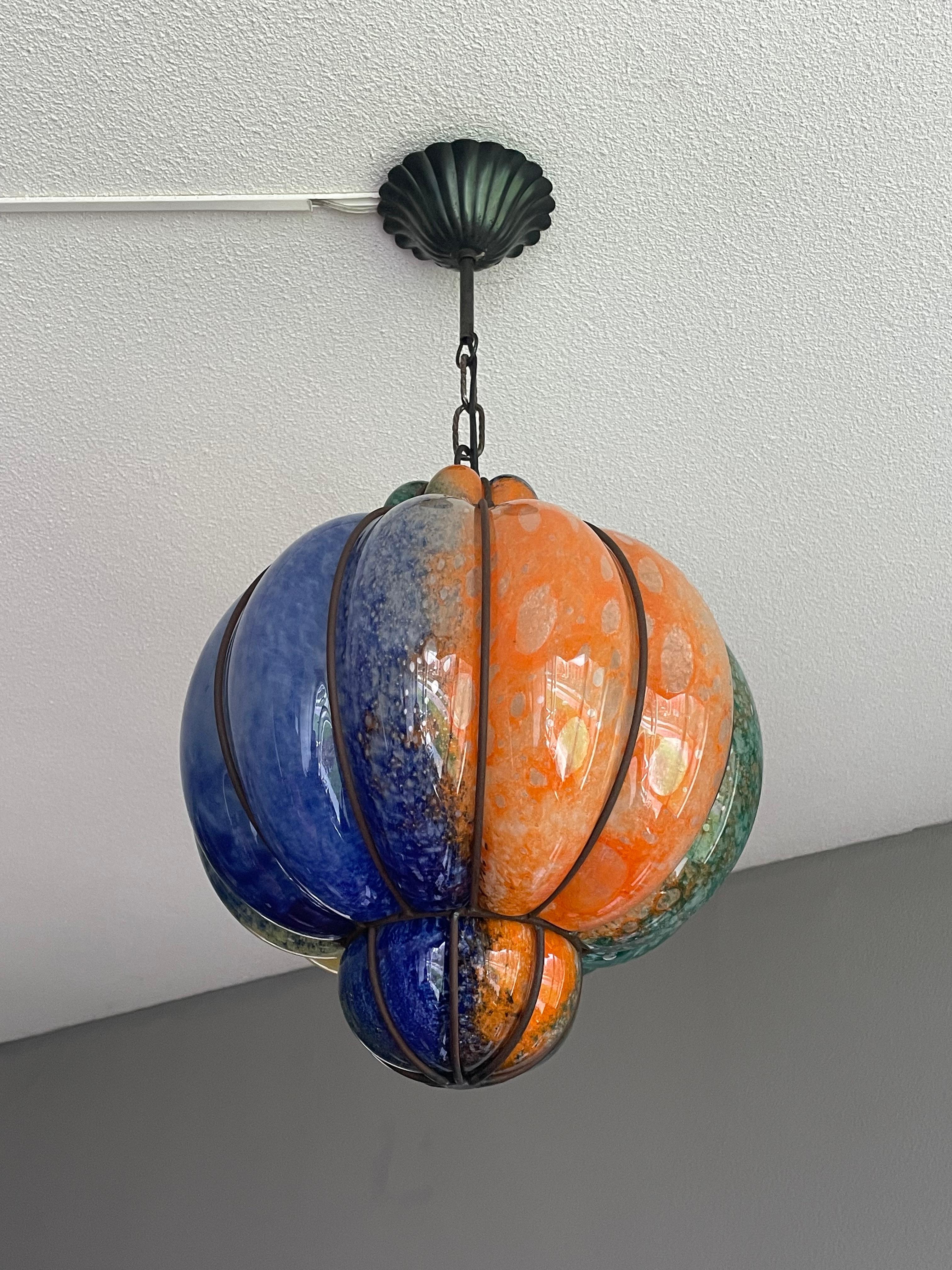 Remarkable Murano light fixture with painter's pallete-like colors.

One of the reasons why we think we have the best job in the world is that we keep finding beautiful and all handcrafted antiques that we have never seen before. We have sold mouth