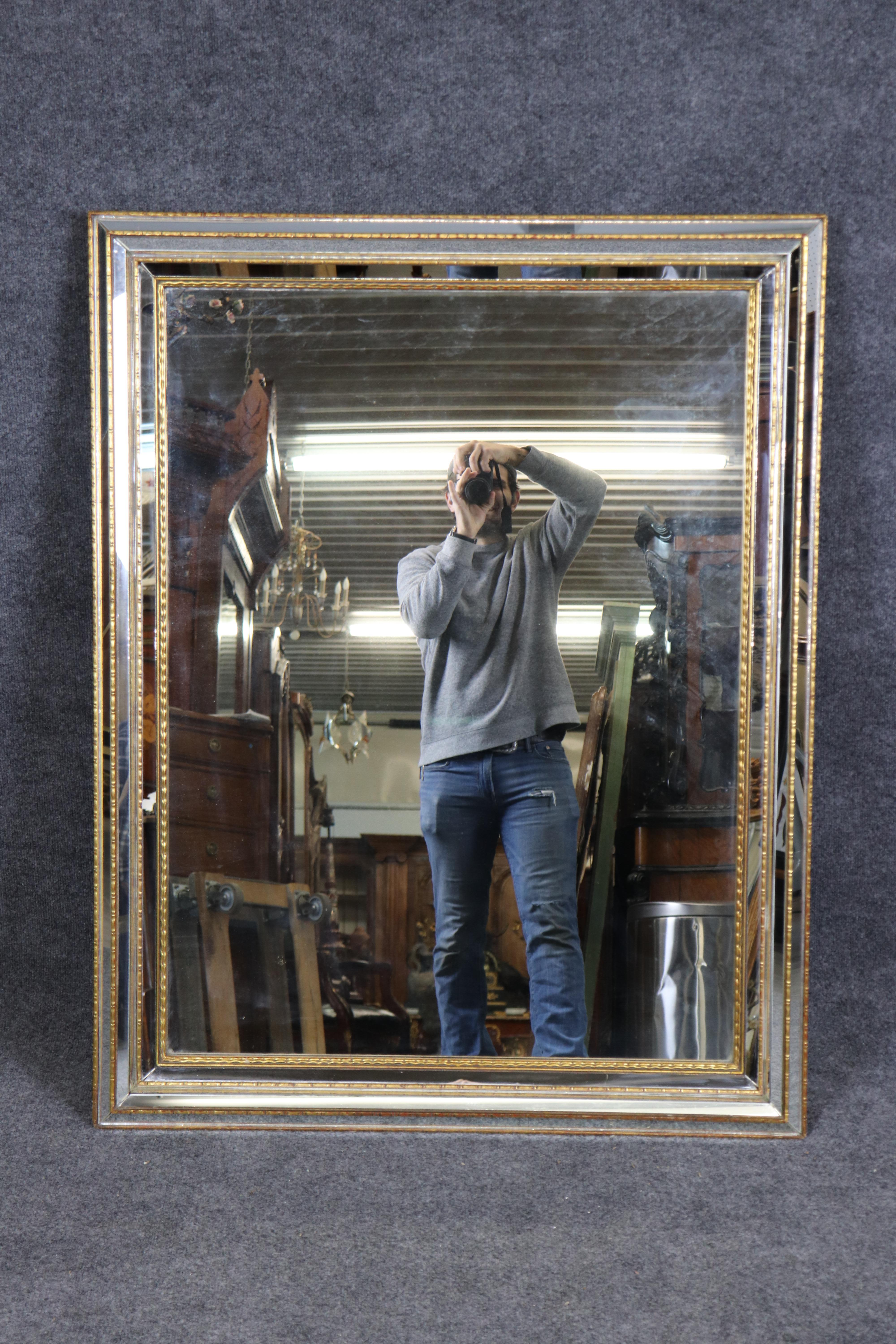 This is a superb LaBarge mirror made in Italy and it's in good condition with gorgeous multi-faceted pieces of hand-cut glass to create a jewelry-like appearance and is in gold leaf. 

Measures 46.75 tall x 36.75 wide x 2.5 deep. Dates to the 1980s