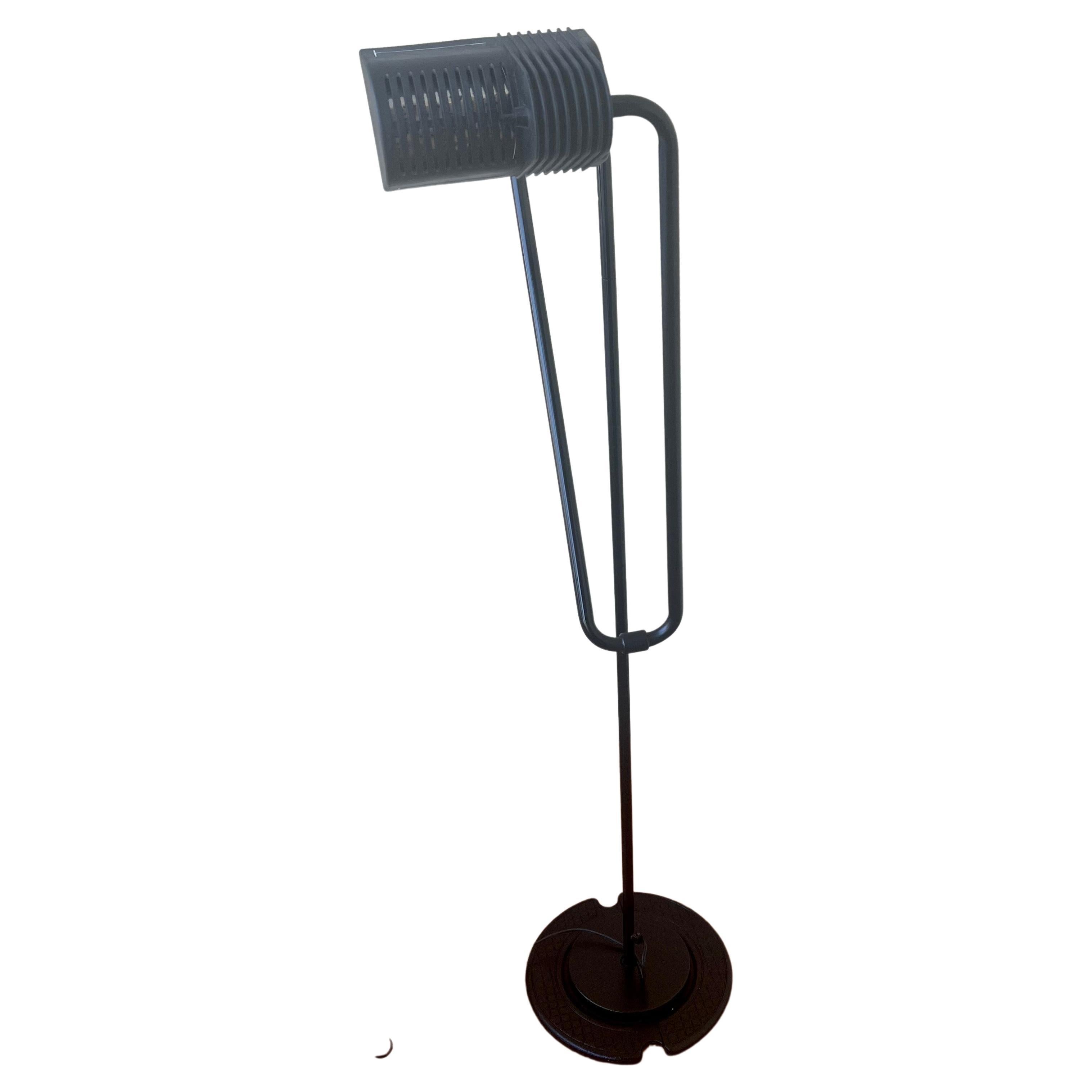 Very rare and in great condition multidirectional floor lamp by Hannes Wettstein for Belux, circa 1980's base is steel with metal enameled piping and movable shade with push off/ on switch, and the arm extends up to 7 feet tall. with an 11