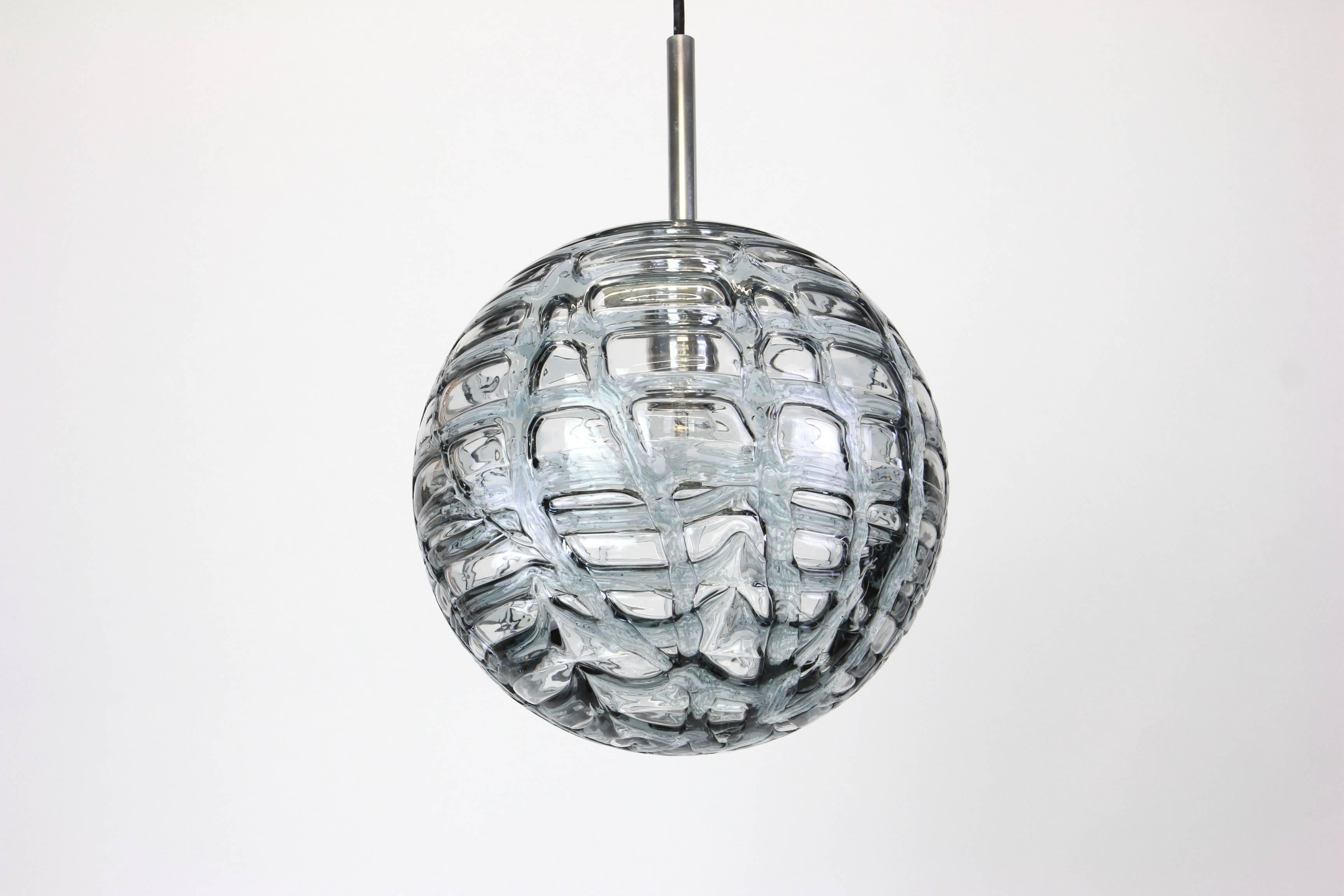 Doria ceiling light with large volcanic Murano glass ball.
High quality of materials, gives a wonderful light effect when it is on.

Sockets: One E27 standard bulbs. Max 80 watt and function on voltage from 110 till 240 volts. (For USA, UK,