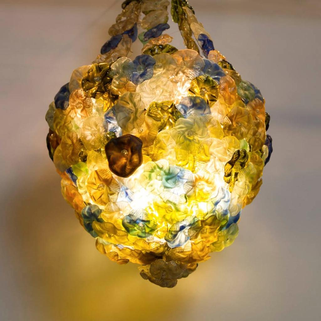 Rare Murano chandelier with glass flowers, circa 1900
Decorative ceiling lamp with eight lighting points and colored, individually pressed glass flowers, Murano, circa 1900. This piece is more an object of glass art than a profane lamp.
The lamp