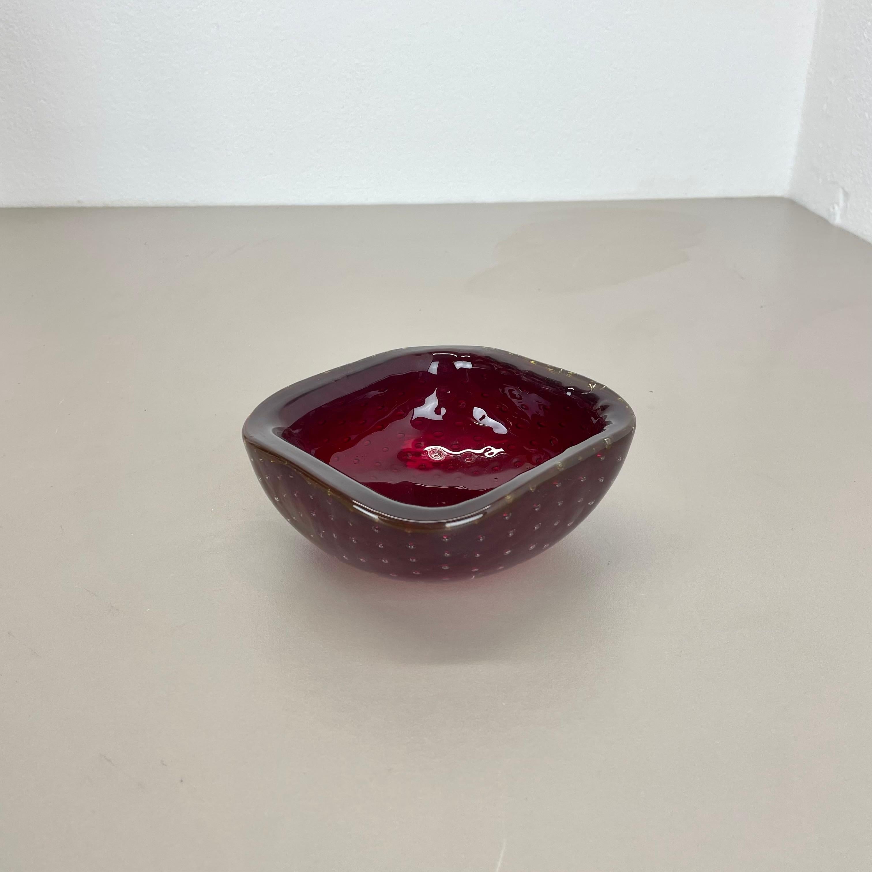 Article:

Murano glass bowl element  ashtray


Origin:

Murano, Italy


Decade:

1970s


This original glass element was produced in the 1970s in Murano, Italy. An elegant dark red Murano glass element utilizing the bullicante technique of