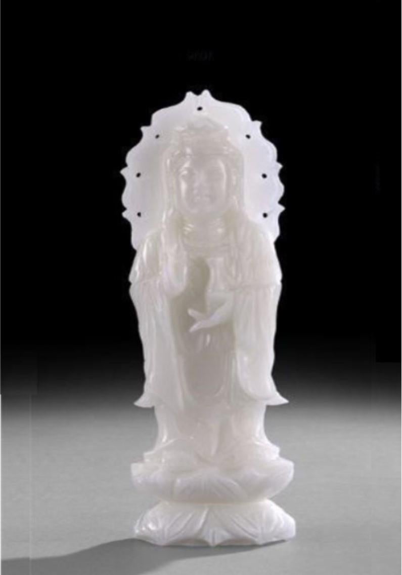 The Following Item we are Offering is a Lovely Museum Quality Large and very elaborately openwork carved in an Exceptional even White Stone. Beautifully carved as a standing figure of the goddess clad in a cowled robe surrounded by a flaming