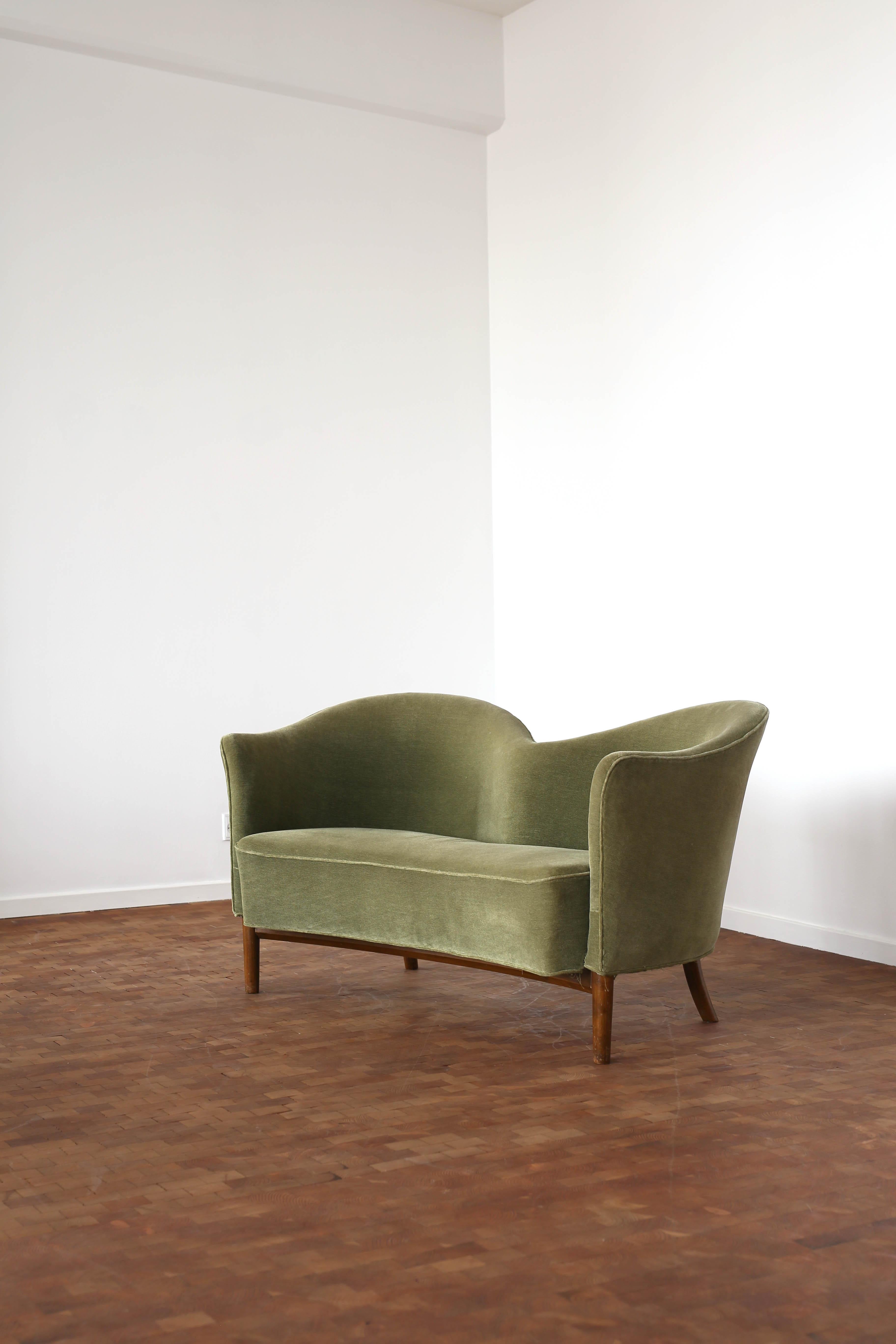 A very rare two-seater sofa designed by Nanna and Jørgen Ditzel in 1949.
The piece is executed by cabinetmaker Knud Willadsen, Denmark, 

The sofa was executed in few examples, presumably less than ten. 

Frame of stained beech, upholstered with