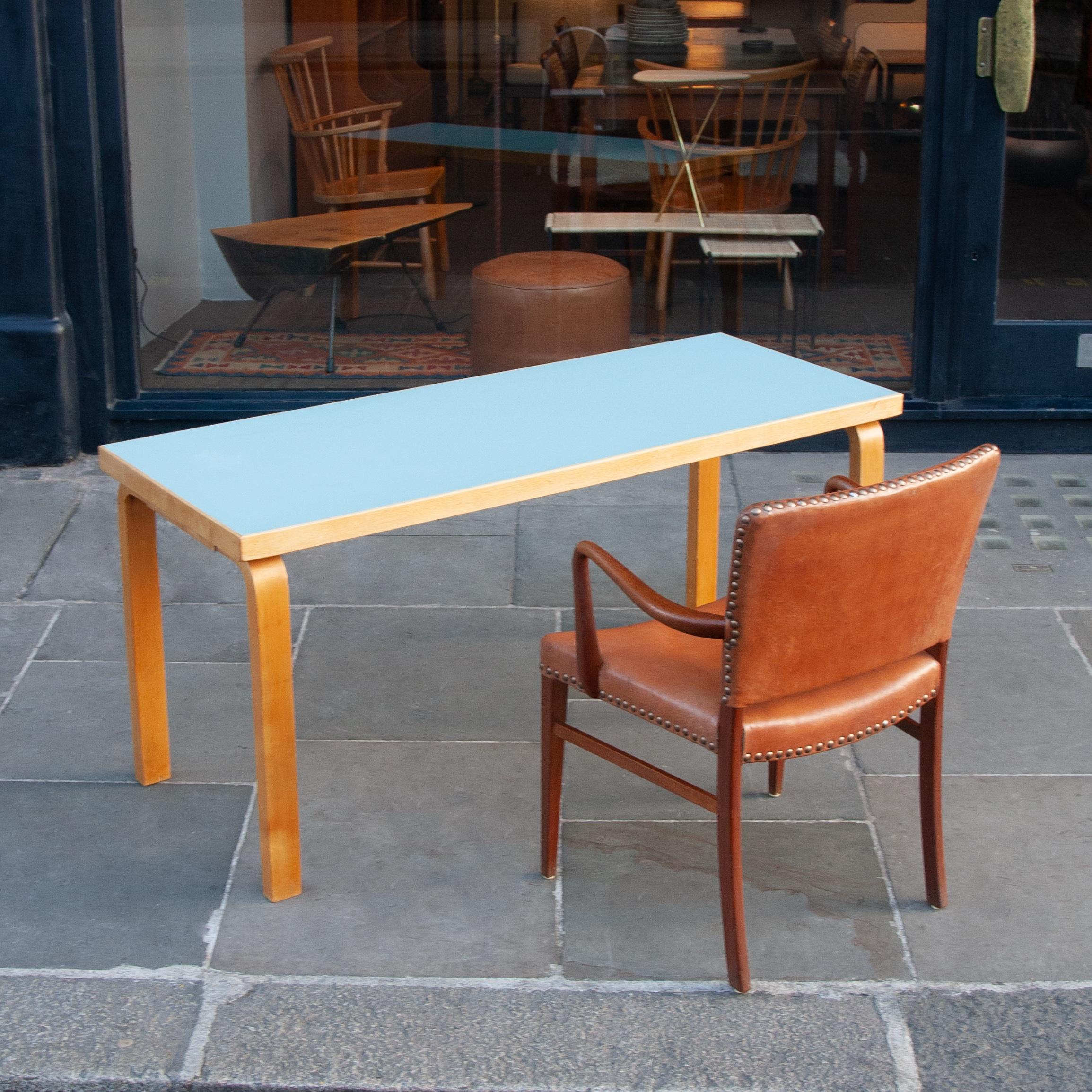 This writing desk or kitchen table is a fine example of designer Alvar Aalto’s bentwood furniture design, produced by his Artek workshop. The unusually narrow proportions of the piece, suggest this was a bespoke commission for a private collector.