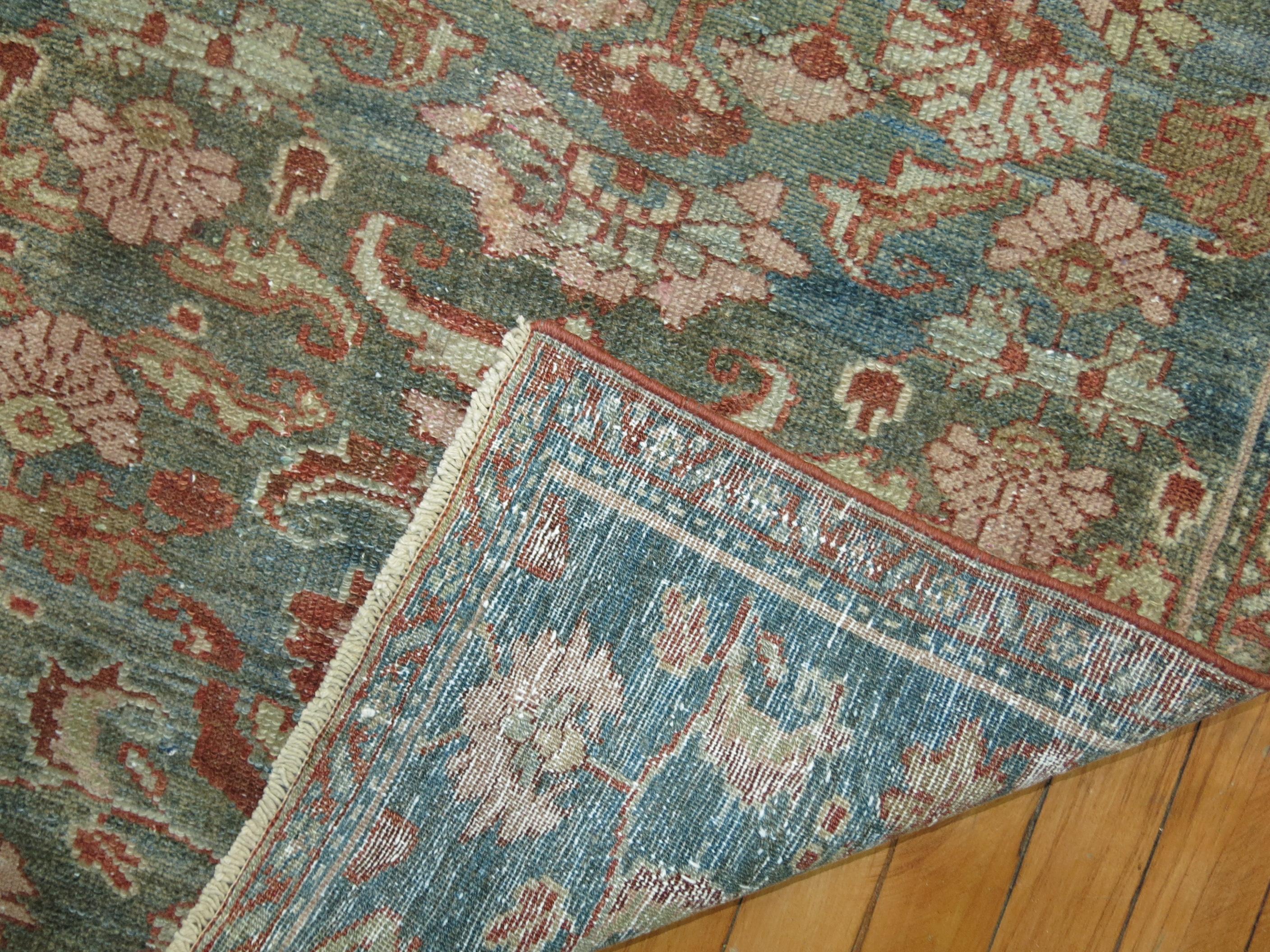 Predominant soft gray-blue-green Persian Malayer runner from the early 20th century. accents in brown and copper

Measures: 2'3