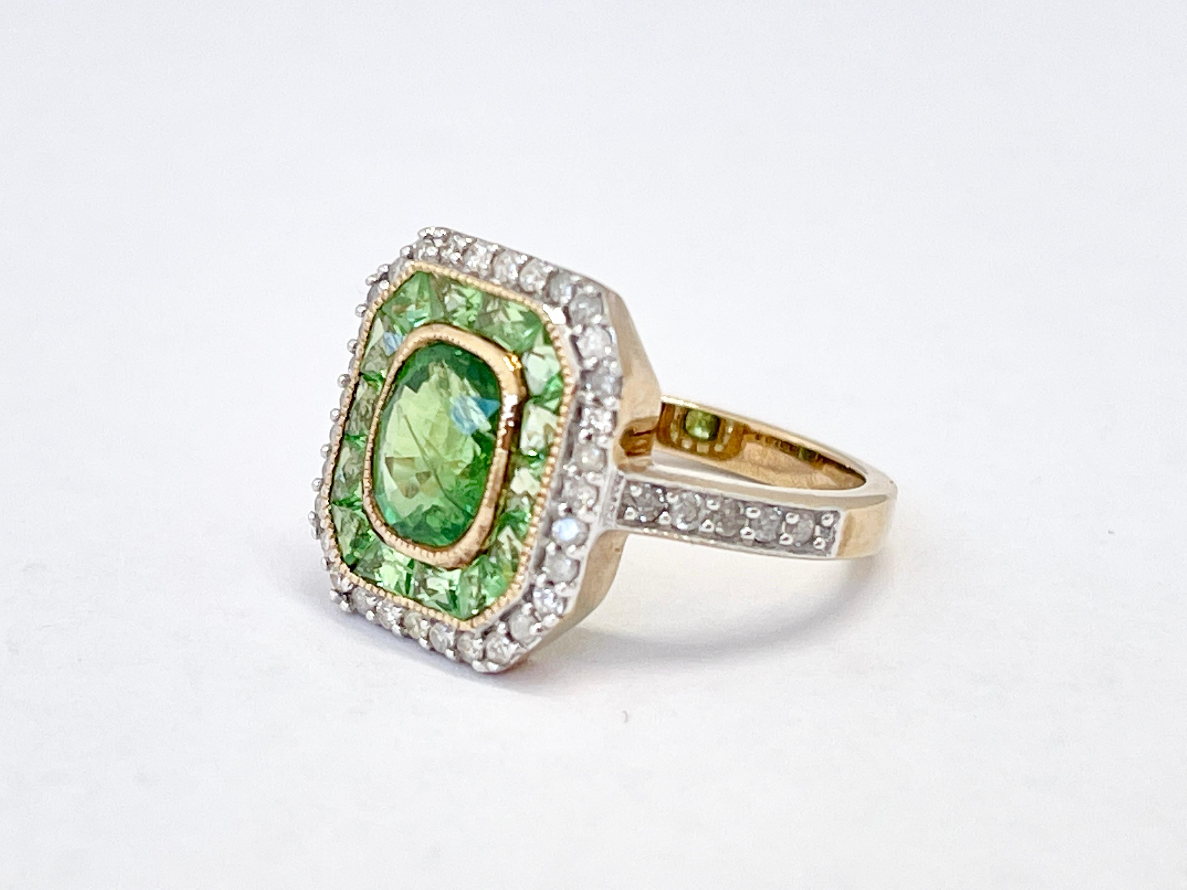 Presenting this intricately designed dress ring.

It features a 1.08ct natural, Tsavorite Garnet that is graded 'medium green'.  Surrounding the centre stone is a row of French Cut Tsavorites that replicate the 'Art Deco' style.  Surrounding the