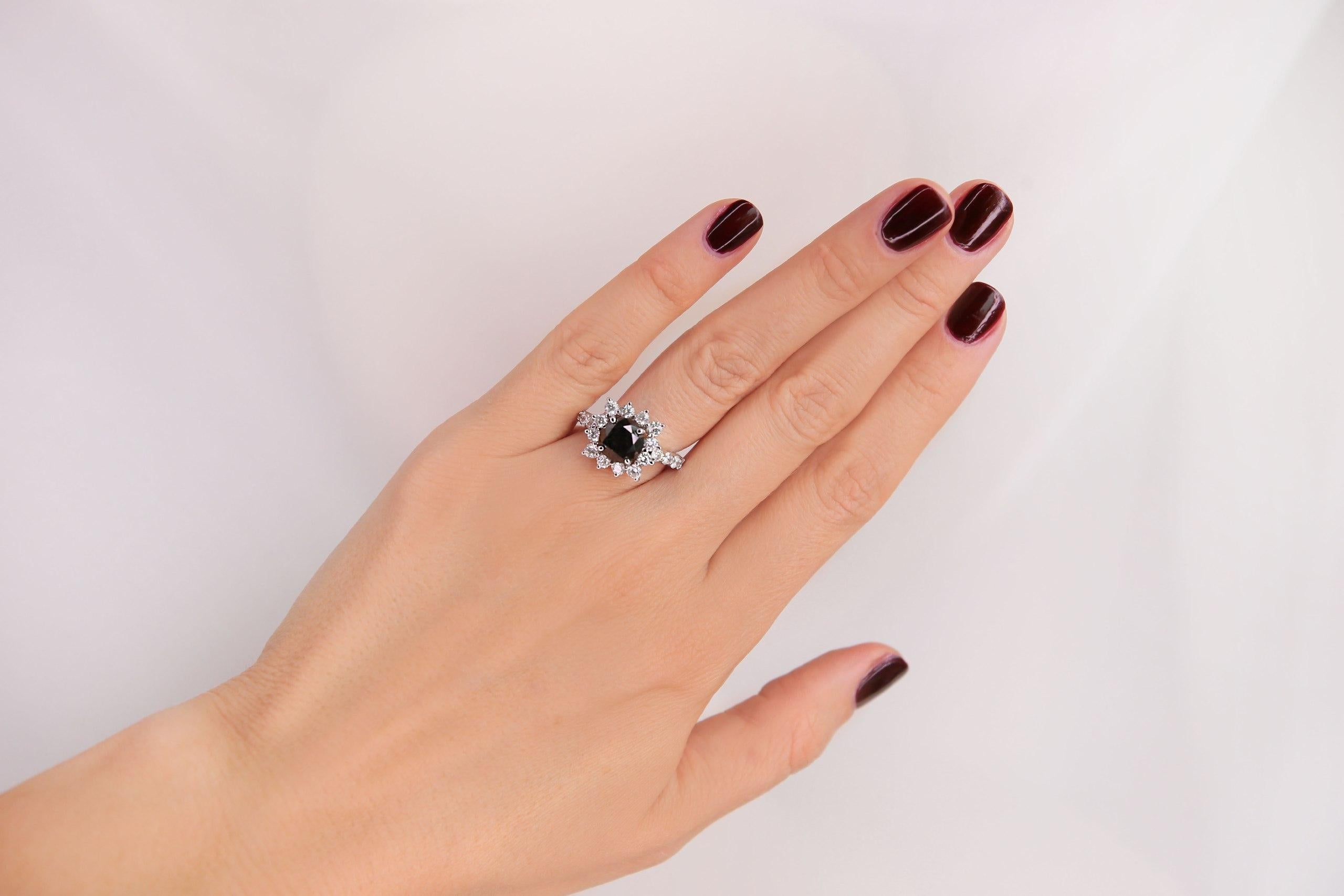 4.75 carat Black Diamond Ring - 14KT White Gold 

Diamond RND 8.38 - 8.31 x 7.29mm, 3.48ct.
Diamond 2.60 - 2.50 x 1.58mm, 
Total weight of 20 Stones = 1.27ct. 
Graded in the setting. Clarity SI-1 to SI-2. 
Color: H - I Cut Good. 
Total Weight of