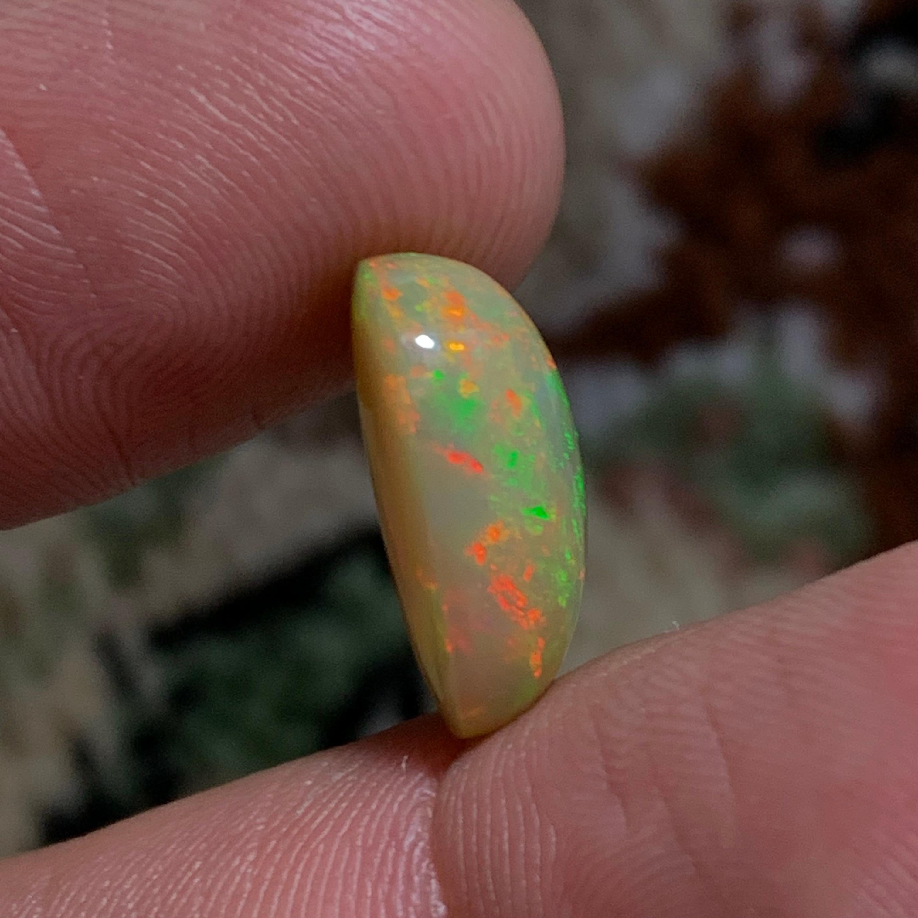 Contemporary Rare Natural Fire Opal Oval Shape with play of colors, 6 Ct-Ethiopia 