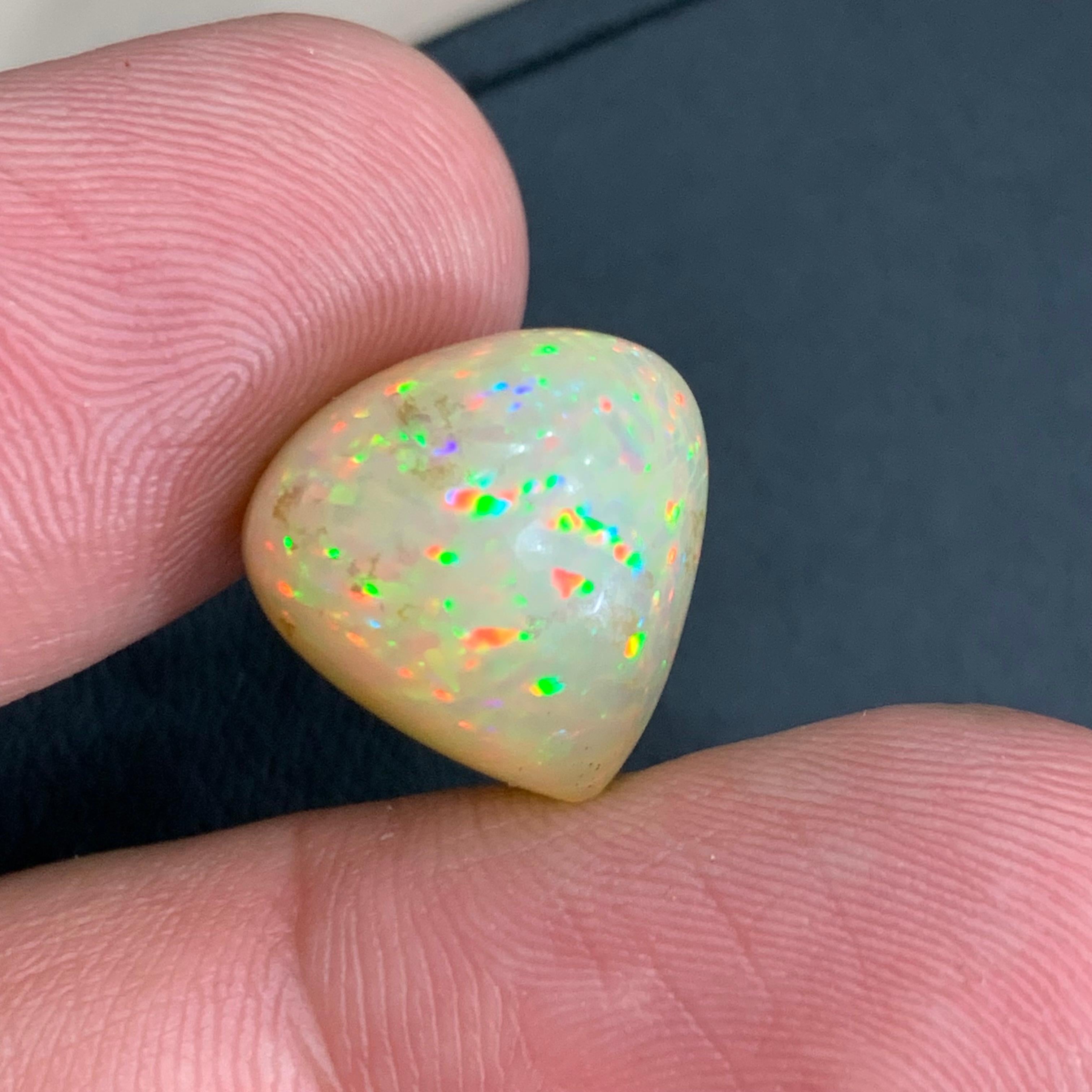 GEMSTONE TYPE: Opal
PIECE(S): 1
WEIGHT: 10.90 Carats
SHAPE: Pear
SIZE (MM): 14.87 x 14.77 x 10.24
COLOR: Play of Colors half white orange
CLARITY: Opaque Play of Colors
TREATMENT: None
ORIGIN: Ethiopia 🇪🇹 
CERTIFICATE: On demand
(if you require a