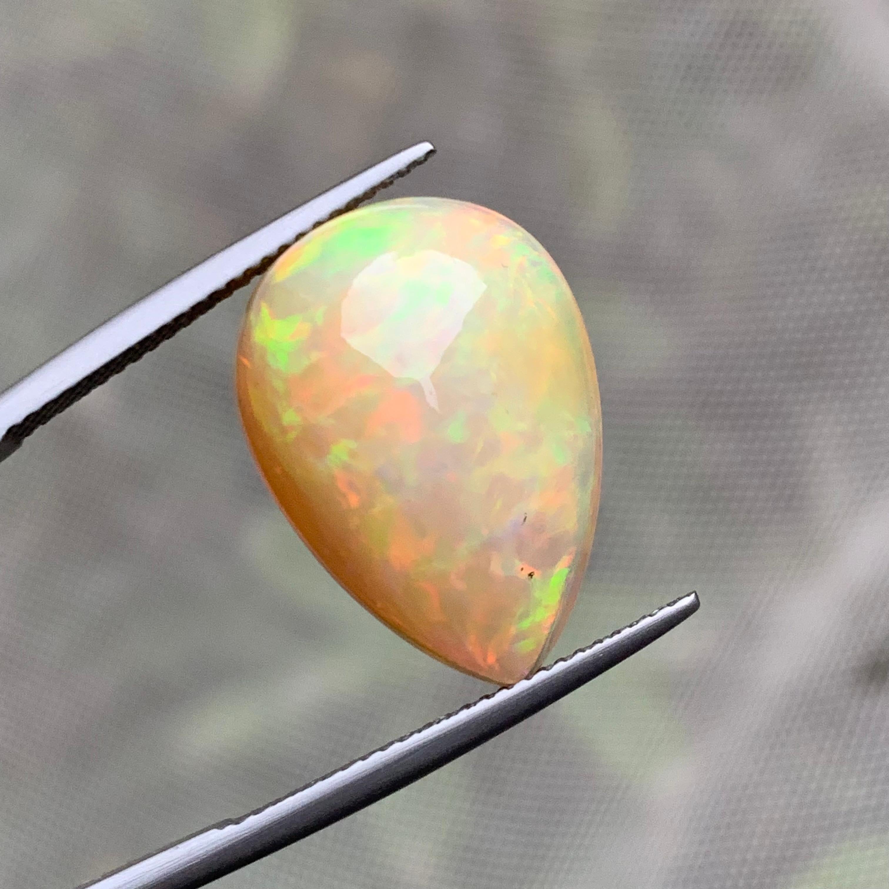 Rare Natural Opal Pear Shape with play of colors full of fire, 10.60Ct-Ethiopia  1