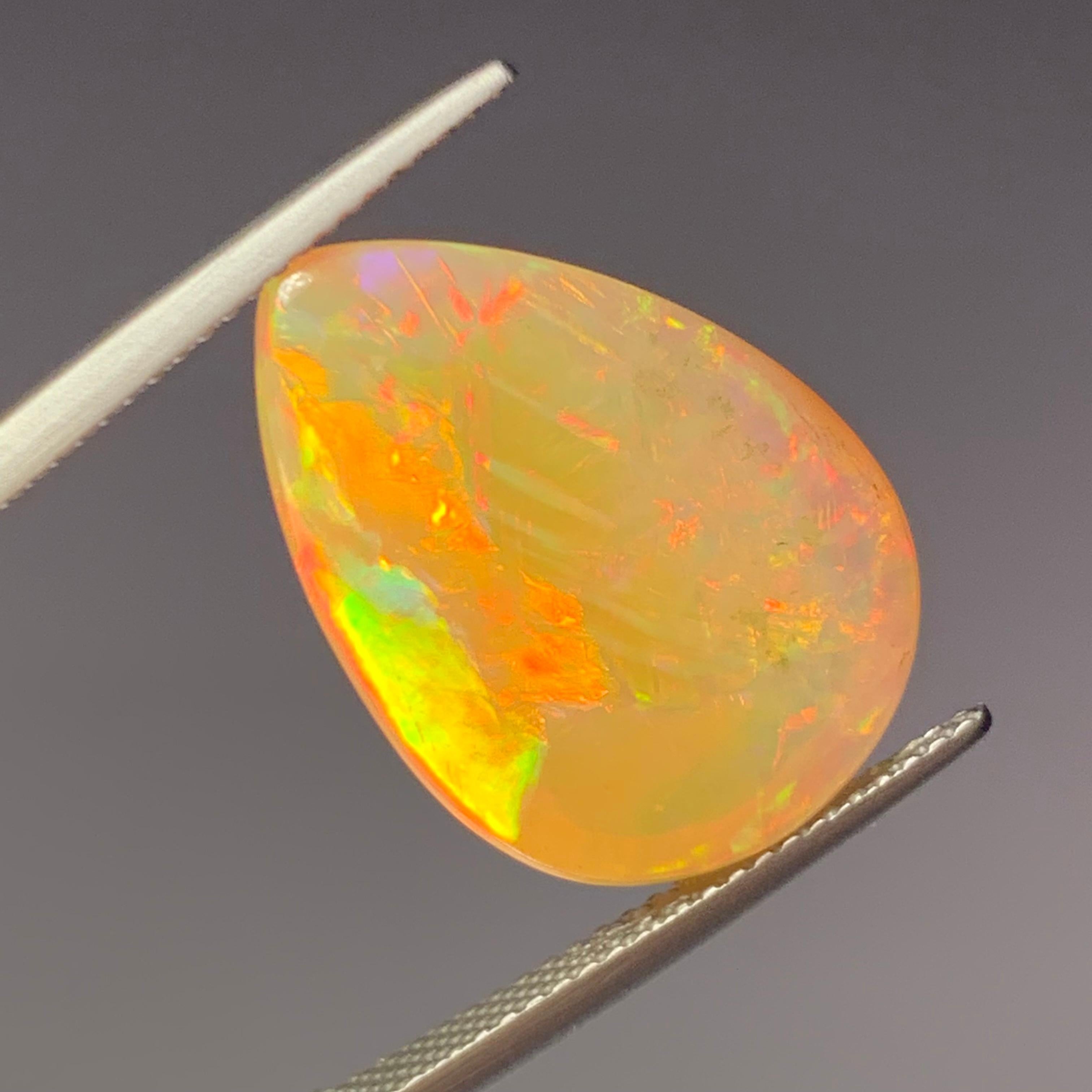 Rare Natural Opal Pear Shape with play of colors full of fire, 10.60Ct-Ethiopia  3