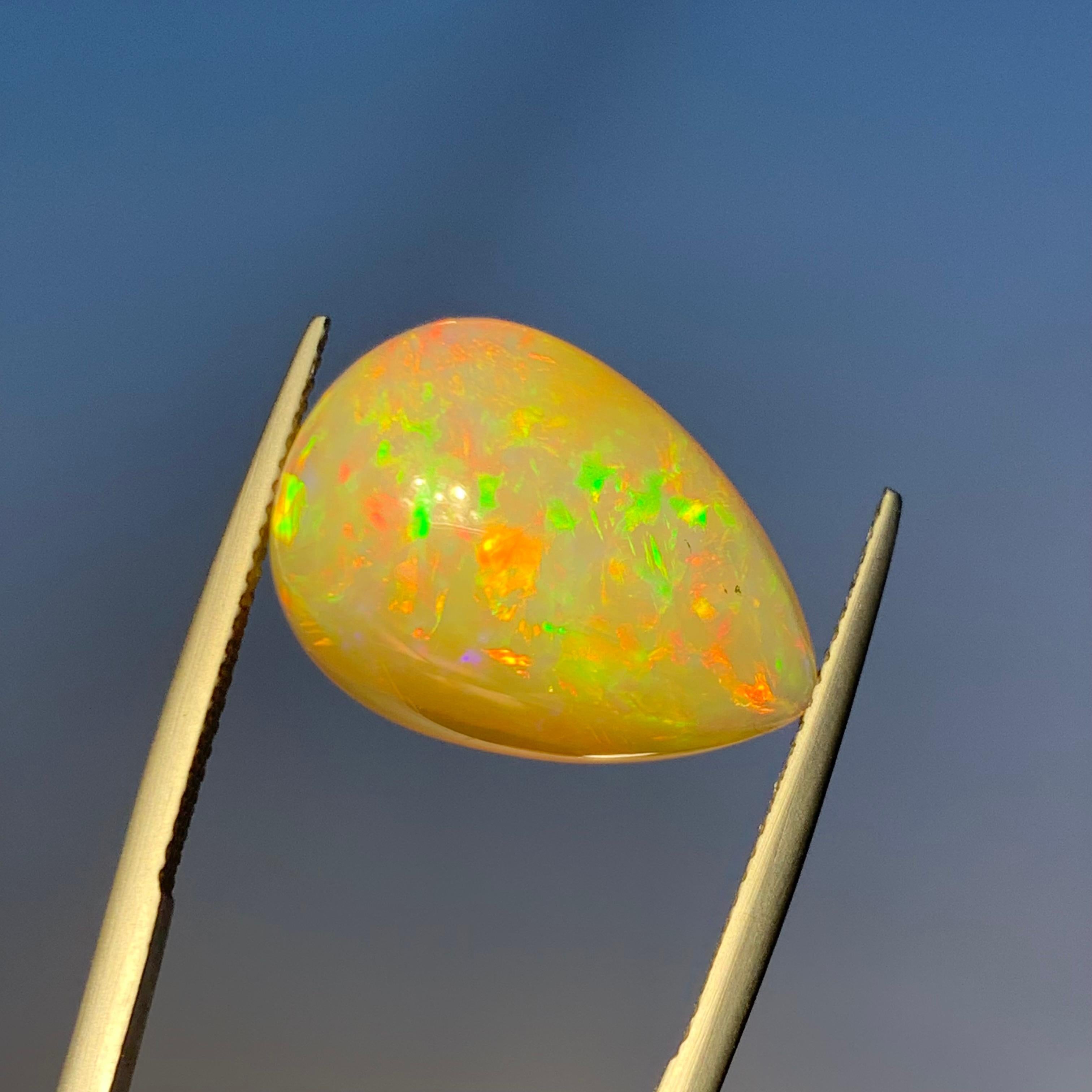 Rare Natural Opal Pear Shape with play of colors full of fire, 10.60Ct-Ethiopia  4
