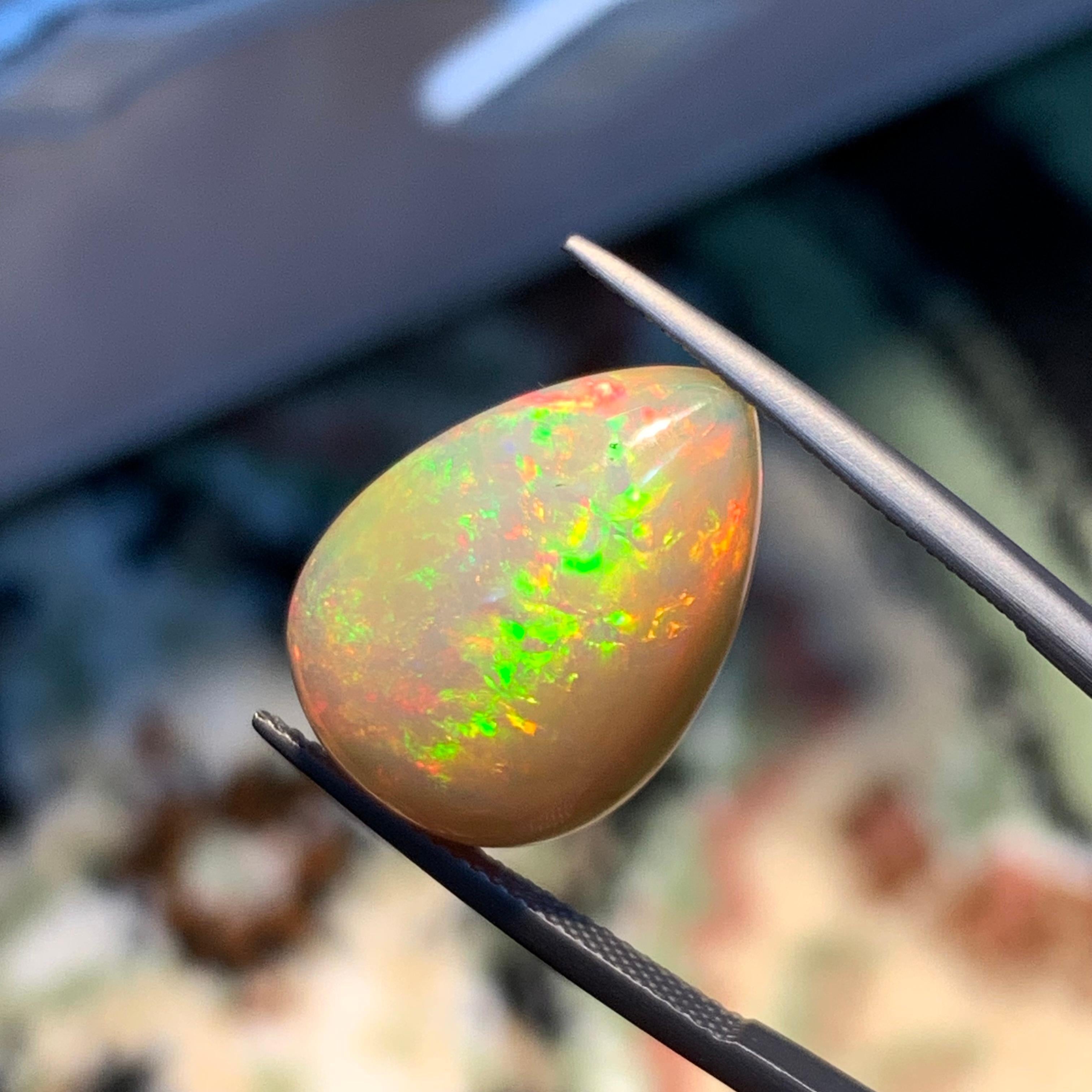 Rare Natural Opal Pear Shape with play of colors full of fire, 10.60Ct-Ethiopia  5