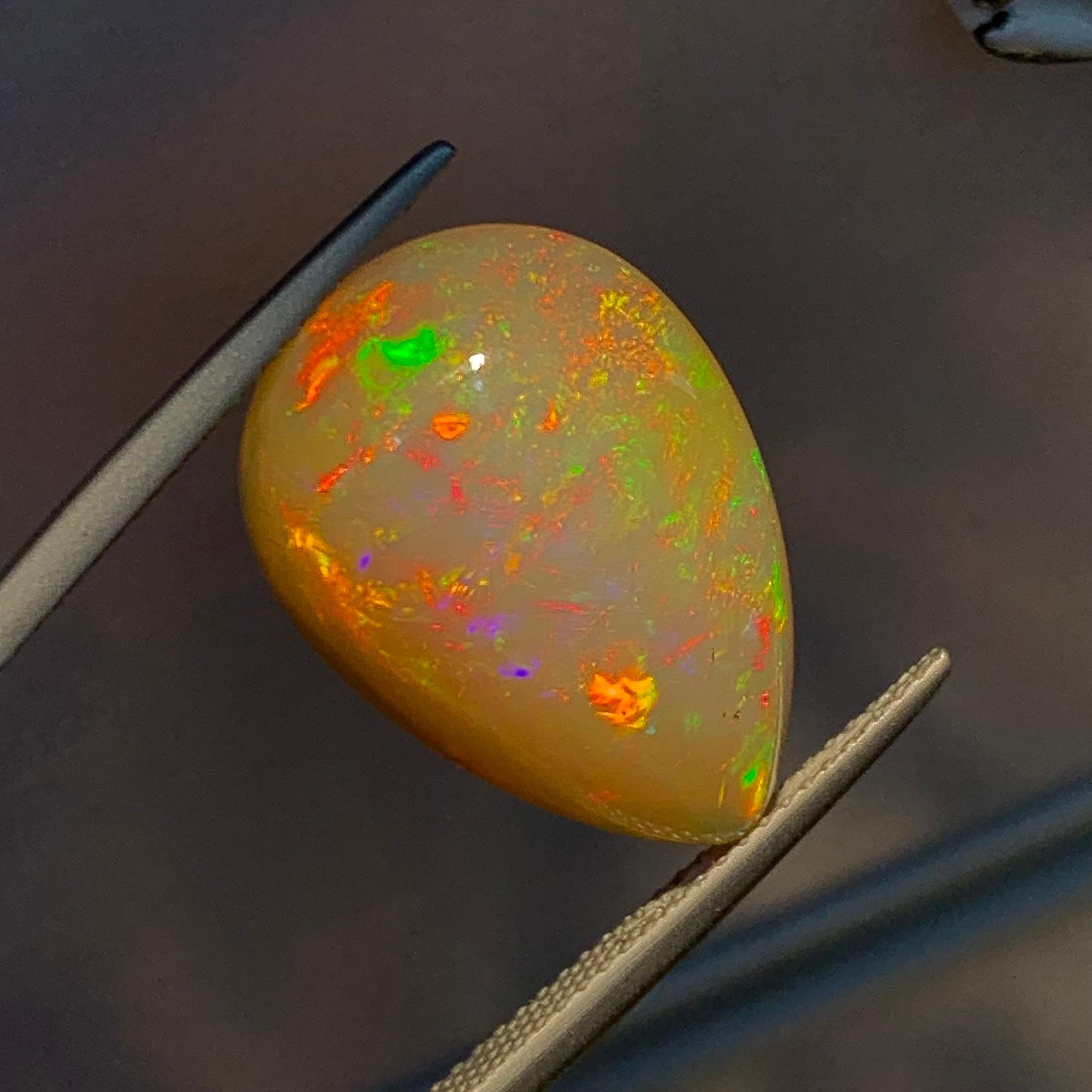 Contemporary Rare Natural Opal Pear Shape with play of colors full of fire, 10.60Ct-Ethiopia 