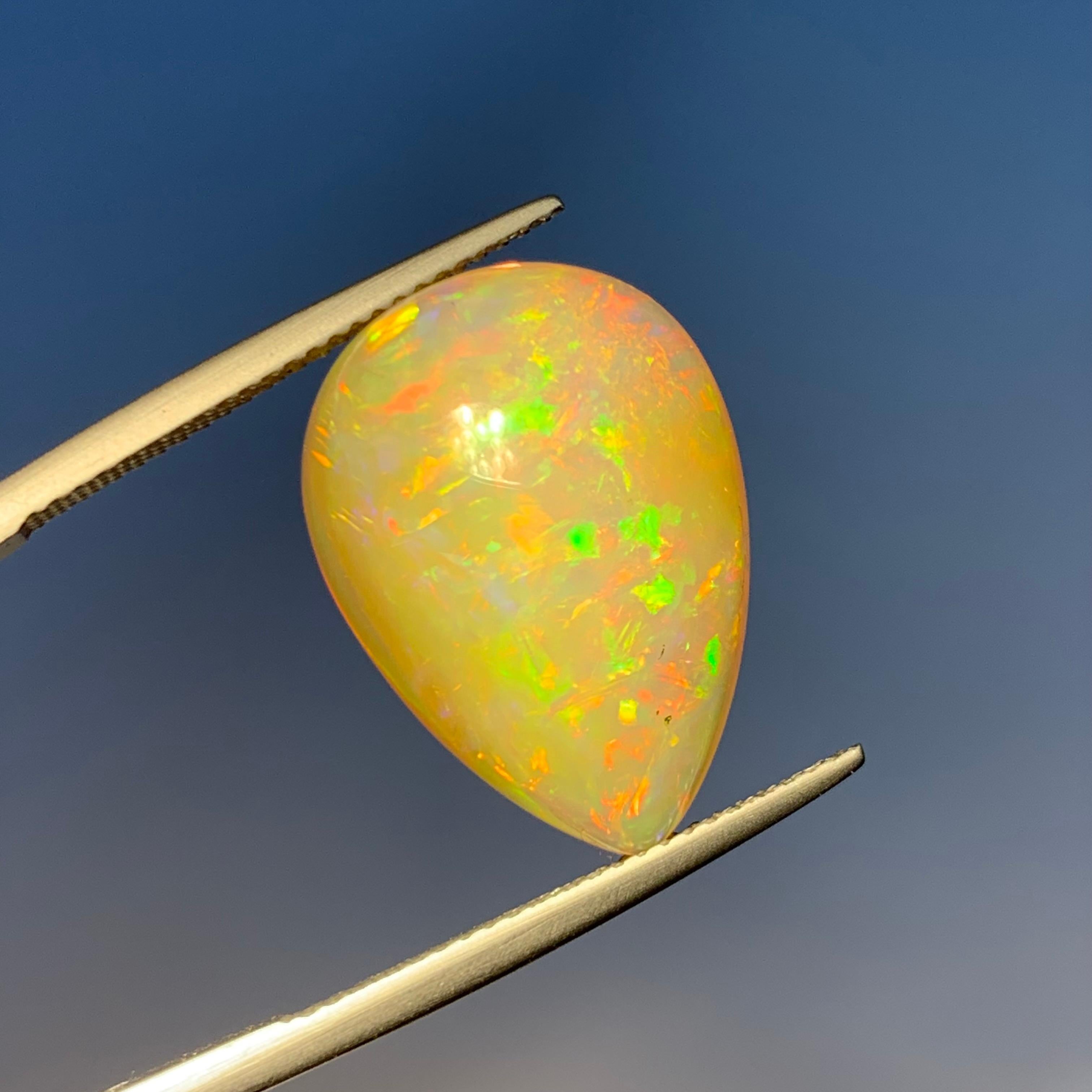 Rare Natural Opal Pear Shape with play of colors full of fire, 10.60Ct-Ethiopia  In New Condition In Peshawar, PK