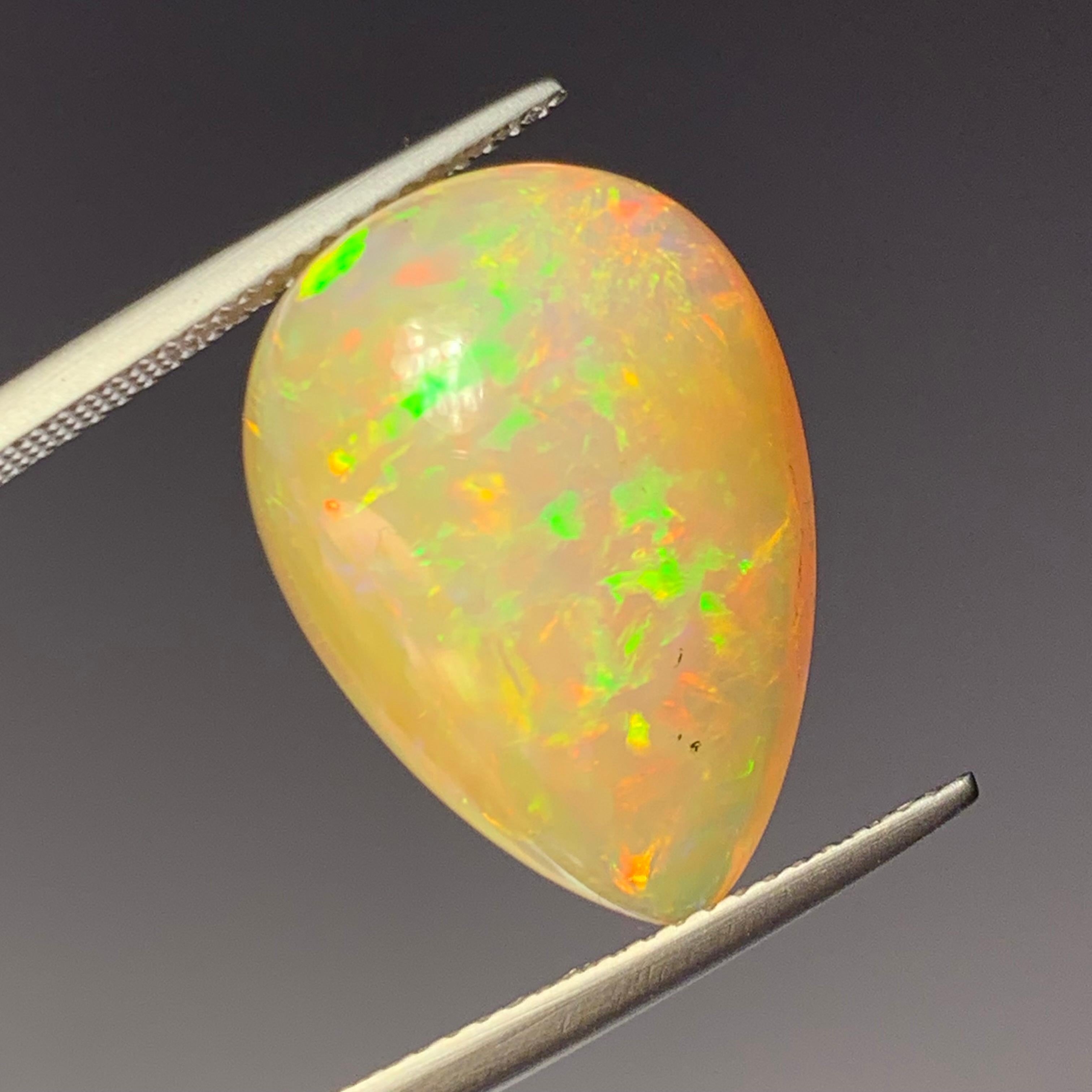 Women's or Men's Rare Natural Opal Pear Shape with play of colors full of fire, 10.60Ct-Ethiopia 