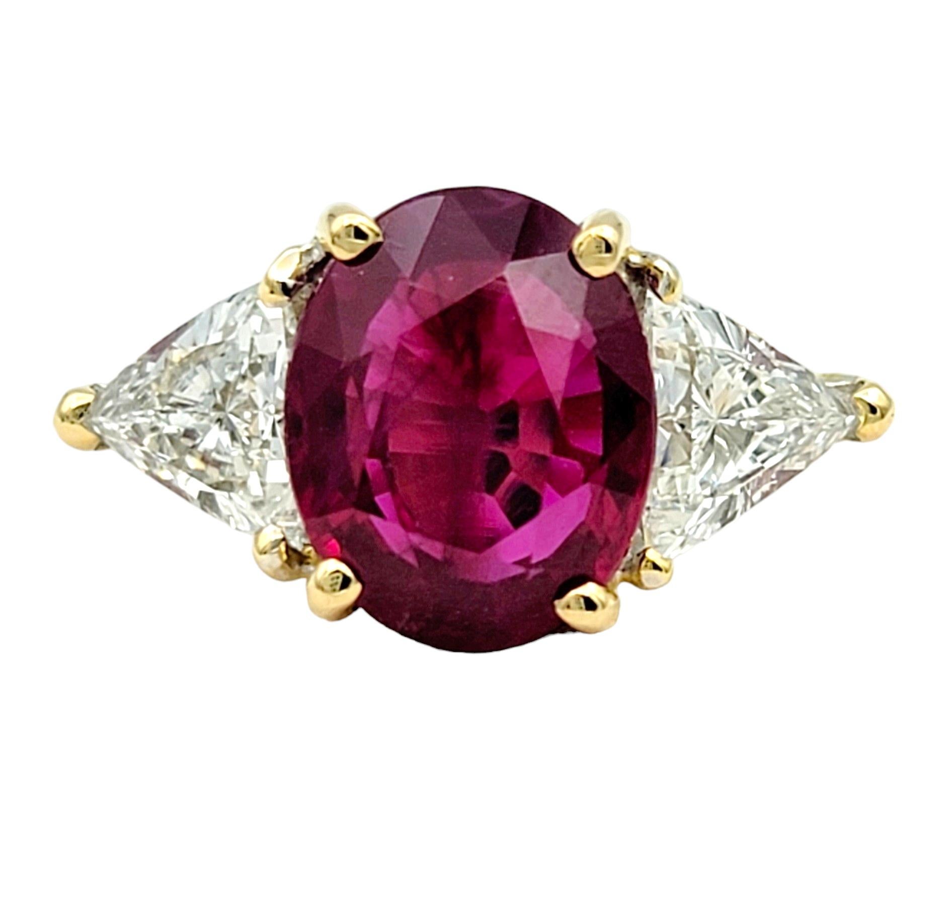 Ring Size: 6

This exquisite ring features a stunning and rare oval cut Burma ruby at its center, set in luxurious 18 karat yellow gold. The vibrant hue of the natural ruby radiates warmth and elegance, capturing attention with its rich color and