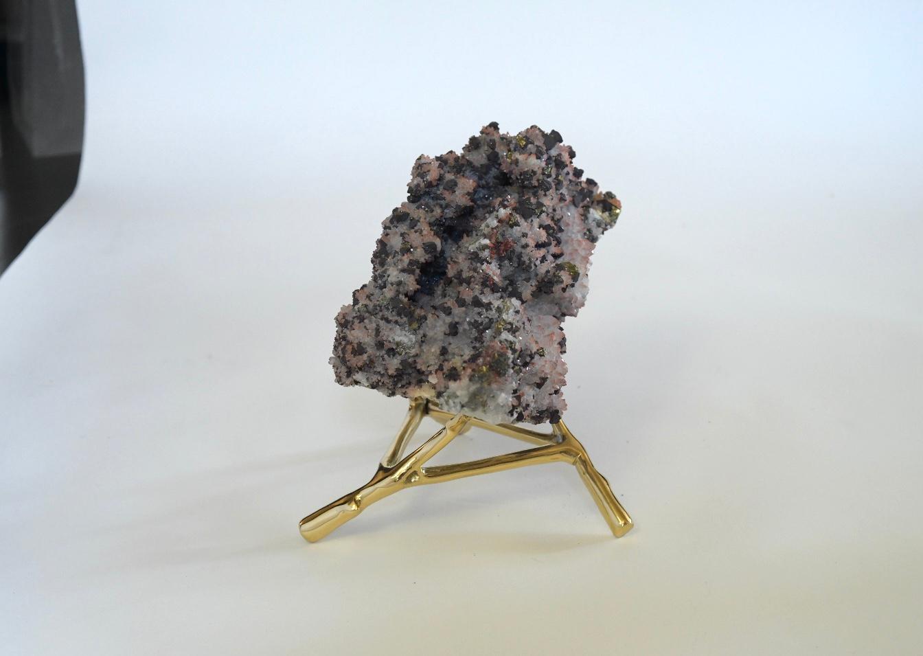 Salt-like, pinkish brown natural sculpture with copper on the surface. Polish brass stand. Measures: 11.5” /L x 7.5” /W x 5” /H.