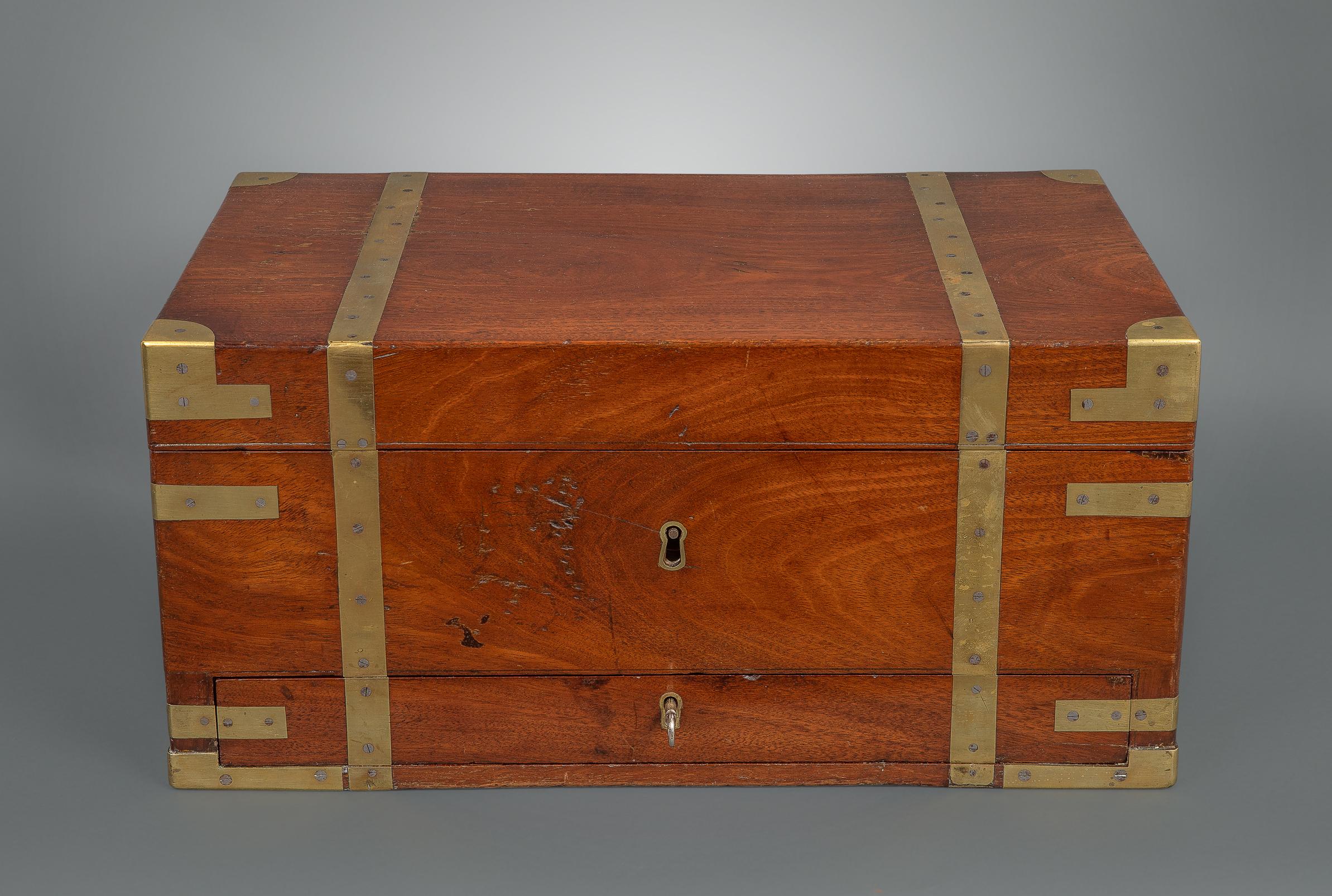 Campaign tea chests are rare, and this example which is clearly for naval use is exceptionally rare. With three foil-lined tea compartments to the main section with a drawer beneath to hold accouterments, flush mounted campaign handles to the sides