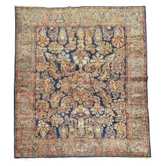 Rare tapis d'Orient Sarouk ancien de couleur bleu marine à motif champ persan