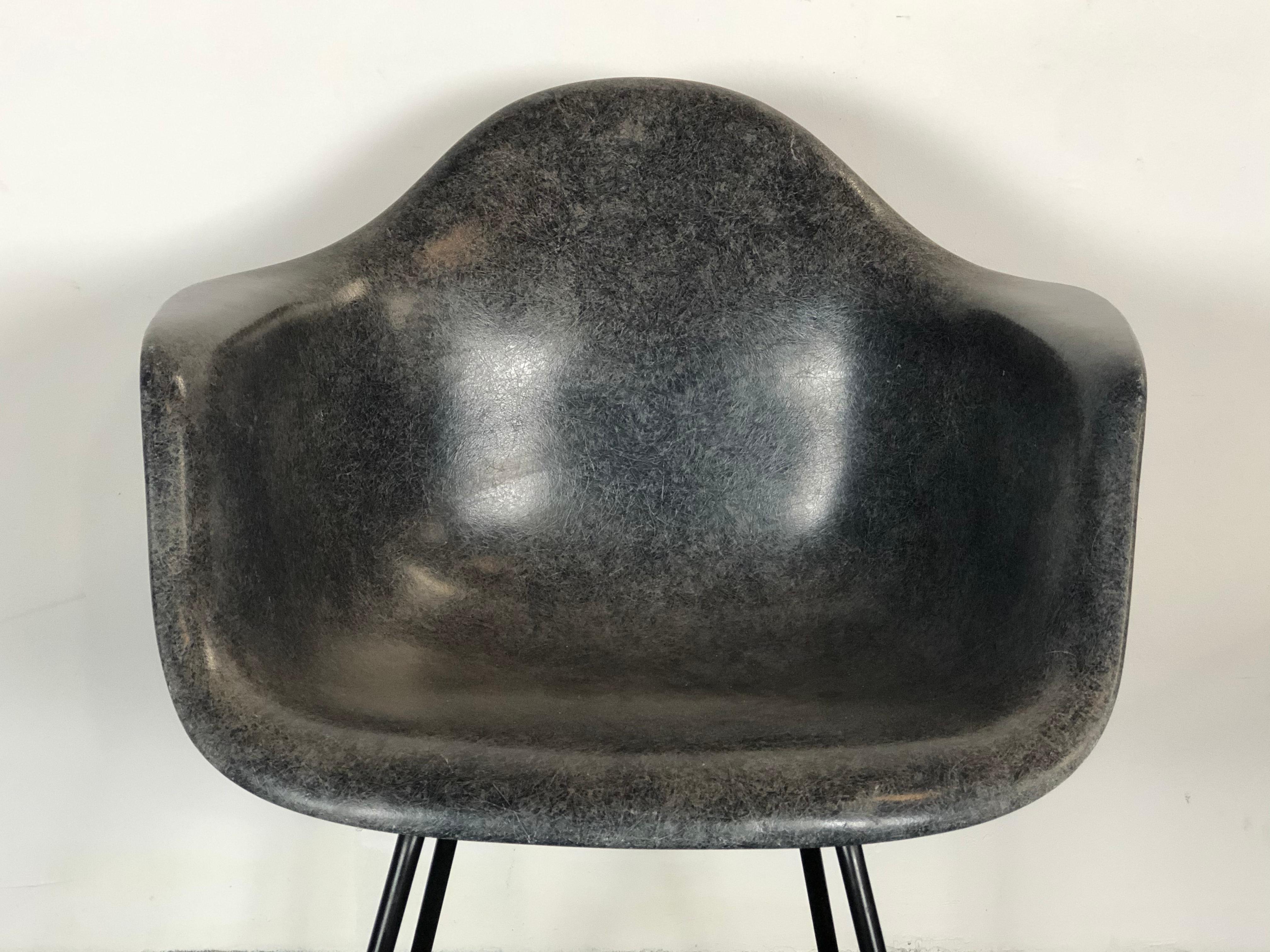 Spectacular and rare Herman Miller Eames fiberglass armchair. Gorgeous textured shell on black steel base. All shock mounts intact and self leveling floor glides present. This is a very sought after yet seldom found color. This particular shell