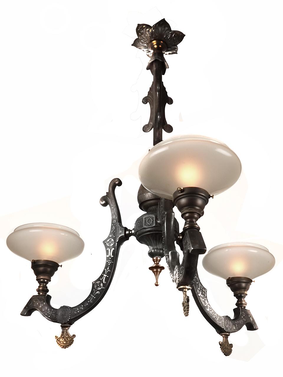 This is a beautiful three-arm Neo-Grec gas chandelier, circa 1870. The fixture is mixed metals of spelter and brass in excellent condition. It is attributed to Cornelius & Baker of Philadelphia. It has been newly wired to take 3 standard light