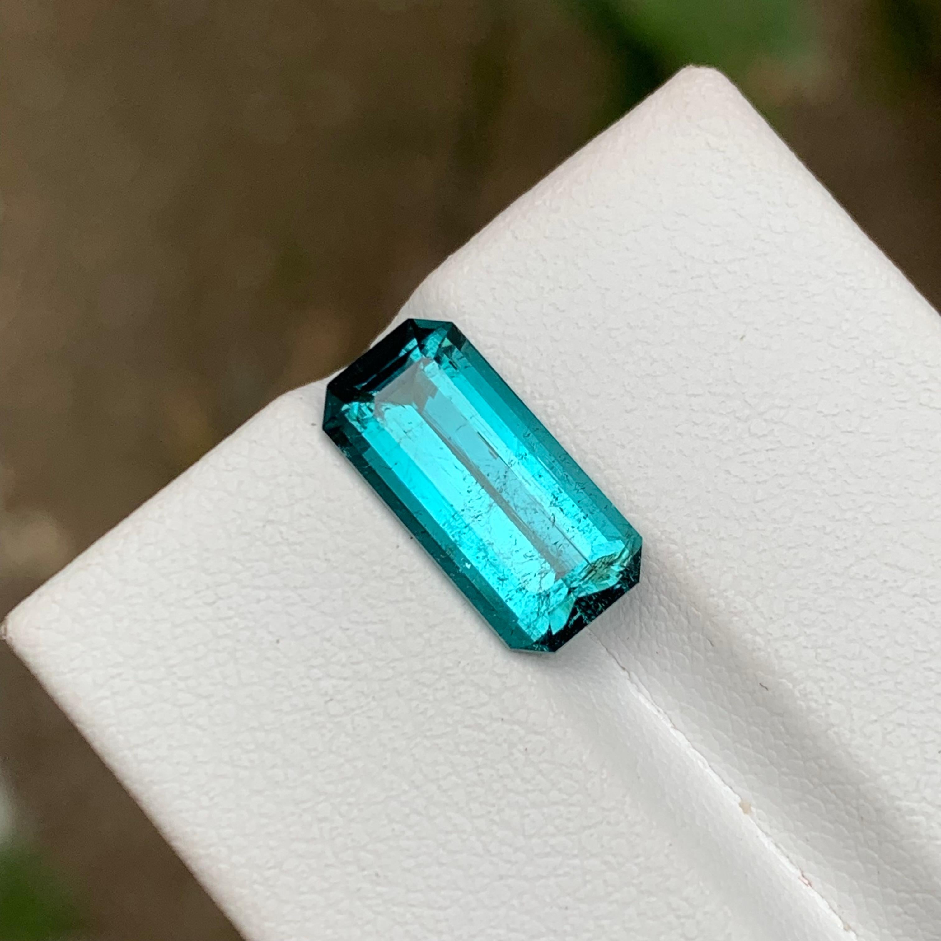 GEMSTONE TYPE: Tourmaline
PIECE(S): 1
WEIGHT: 4.00 Carats
SHAPE: Emerald Cut
SIZE (MM): 13.82 x 6.72 x 5.07
COLOR: Neon Electric Blue
CLARITY: Slightly Included
TREATMENT: None
ORIGIN: Afghanistan
CERTIFICATE: On demand
(if you require a