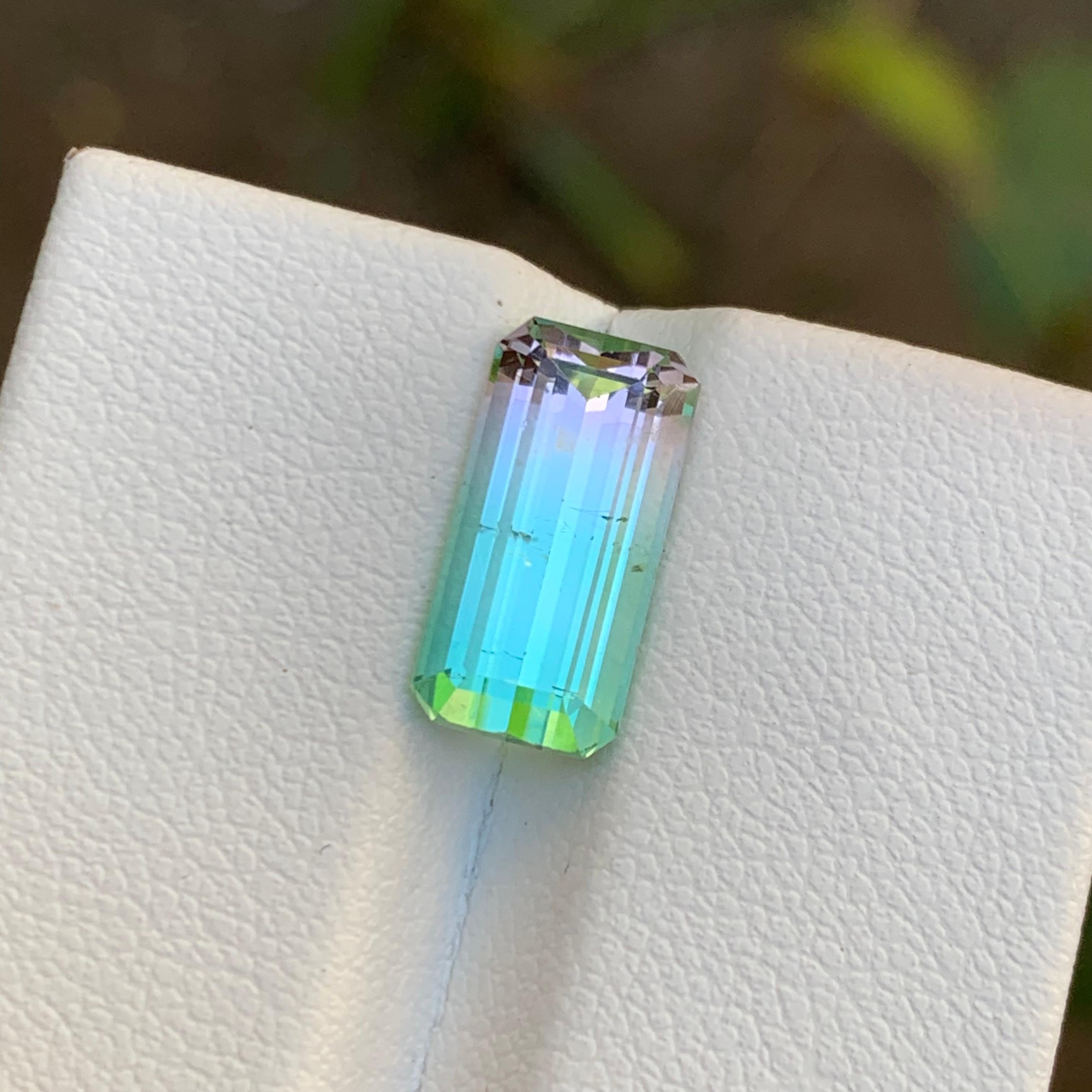 GEMSTONE TYPE: Tourmaline
PIECE(S): 1
WEIGHT: 3.95 Carats
SHAPE: Emerald Cut
SIZE (MM): 13.03 x 6.48 x 5.22
COLOR: Bicolor Neon Bluish Green and Pink
CLARITY: Slightly Included 
TREATMENT: None
ORIGIN: Afghanistan
CERTIFICATE: On demand
(if you