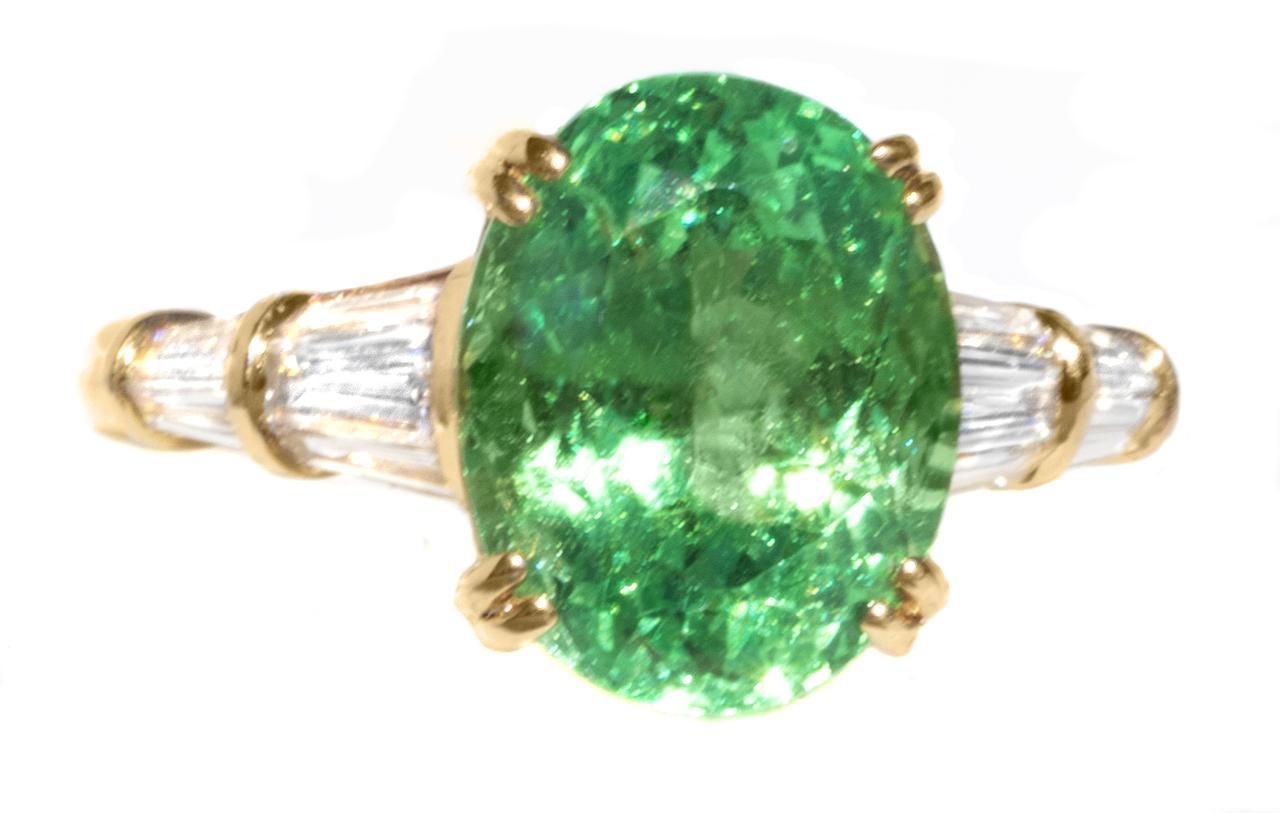 Talk about rare!

This beautiful ring has one of the rarest and most sought-after gemstones:  The neon Kelly green grossular garnets. Most people think that garnets are just red. This is one of the most beautiful garnets in the world. Kelly green