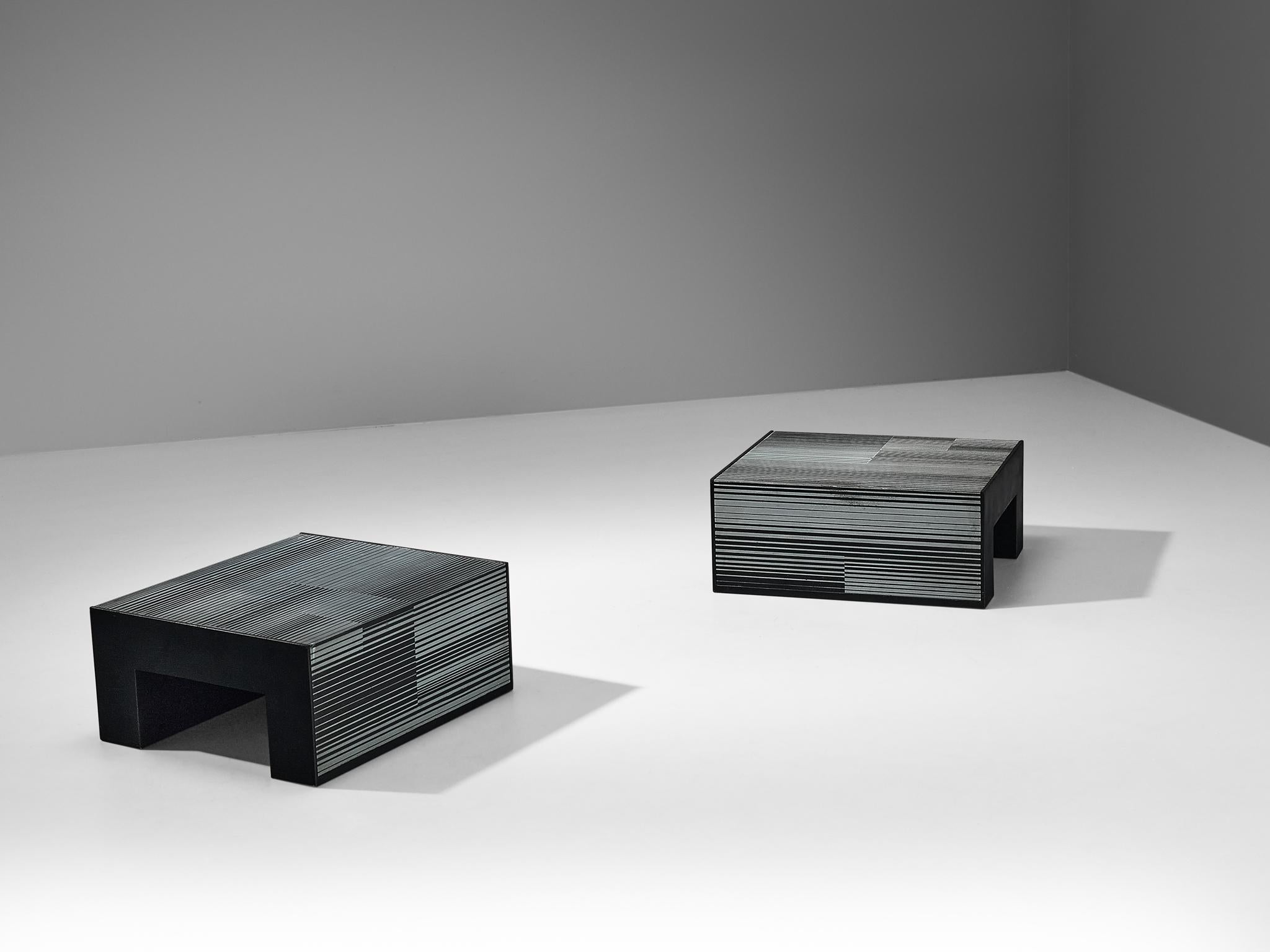 Giovanni Ceccarelli and Gianni Patuzzi for Gruppo NP2, pair of coffee tables, black enameled wood, zinc, Italy, circa 1975

These coffee or side tables, created by the renowned Gruppo NP2, have a compelling and interesting design. The tables are